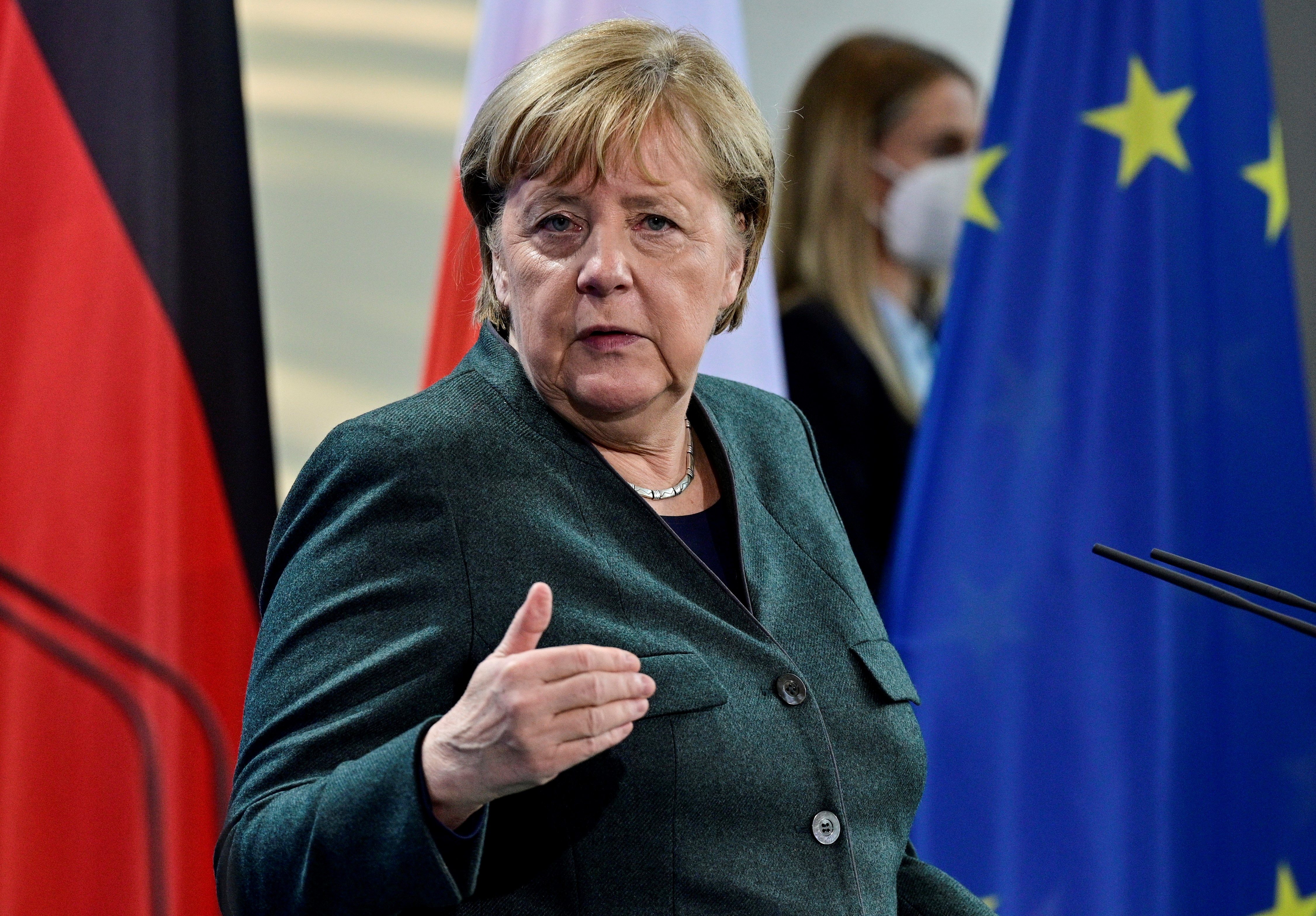 German Chancellor Angela Merkel gestures as she and Polish Prime Minister Mateusz Morawiecki (not pictured) address a joint press conference after talks in Berlin, Germany November 25, 2021. John MacDougall/Pool via REUTERS