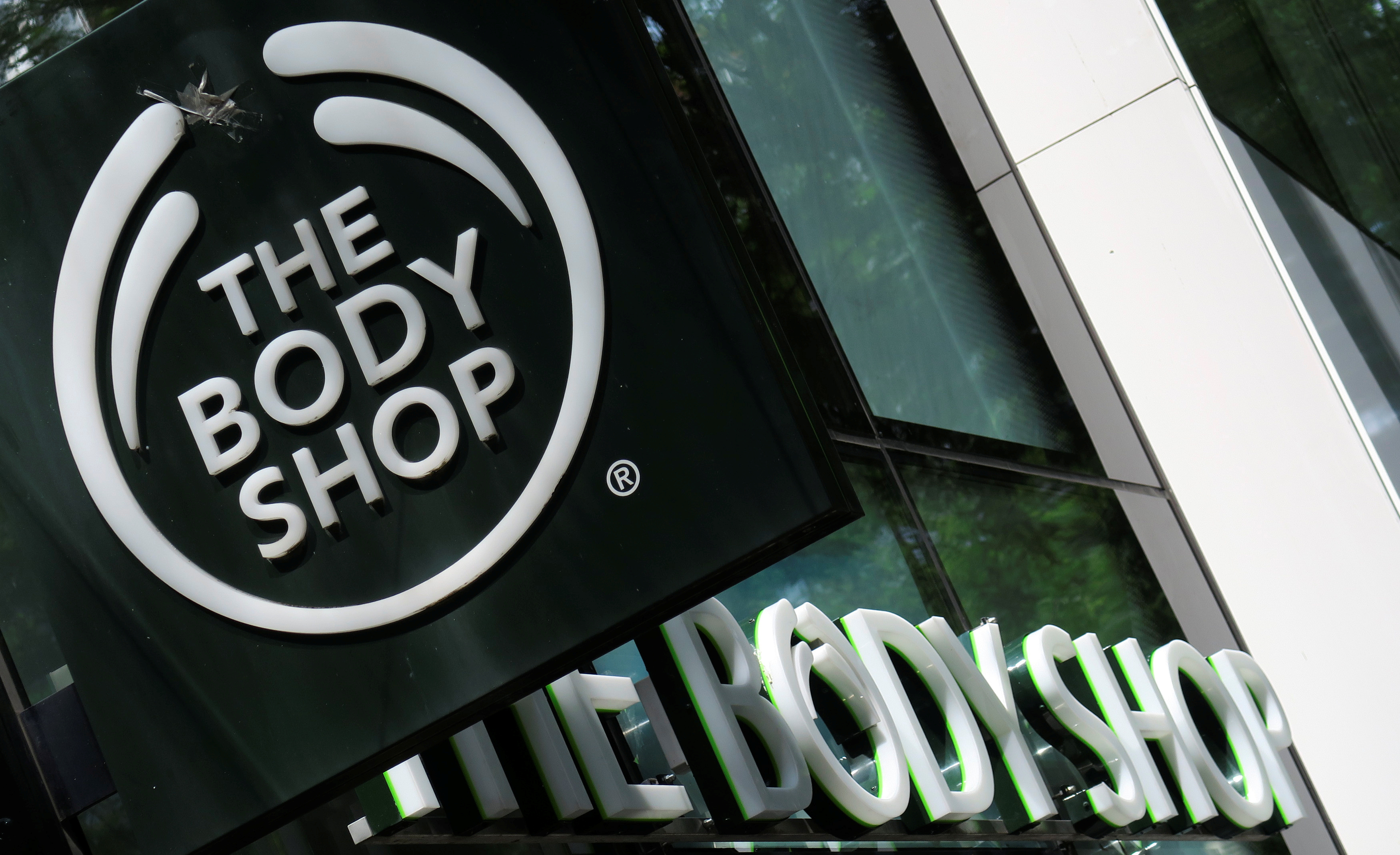 The logo of British cosmetics and skin care company The Body Shop is seen outside a store in Vienna