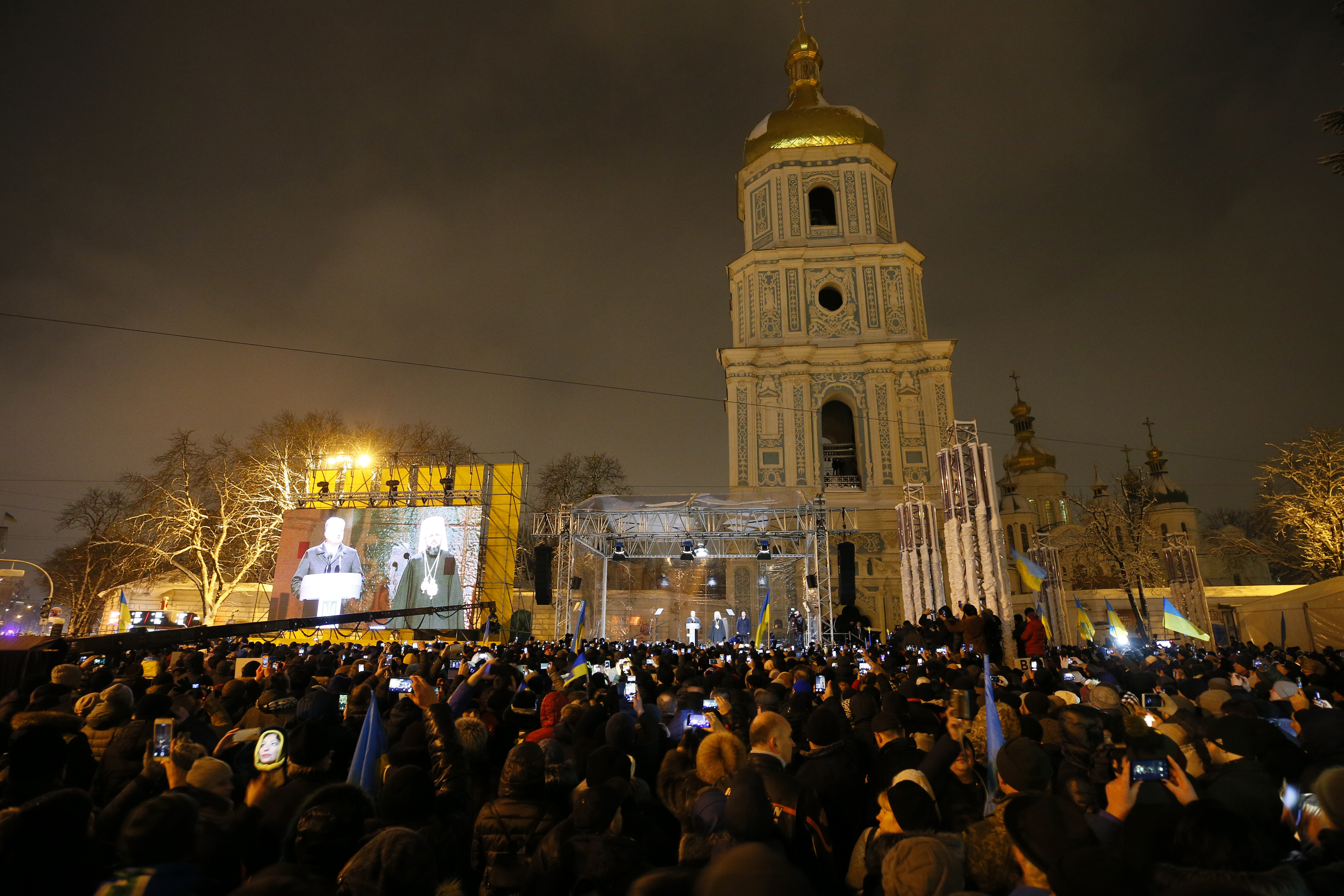 Ukrainian believers gather at the front of the Saint Sophia's Cathedral in Kyiv,