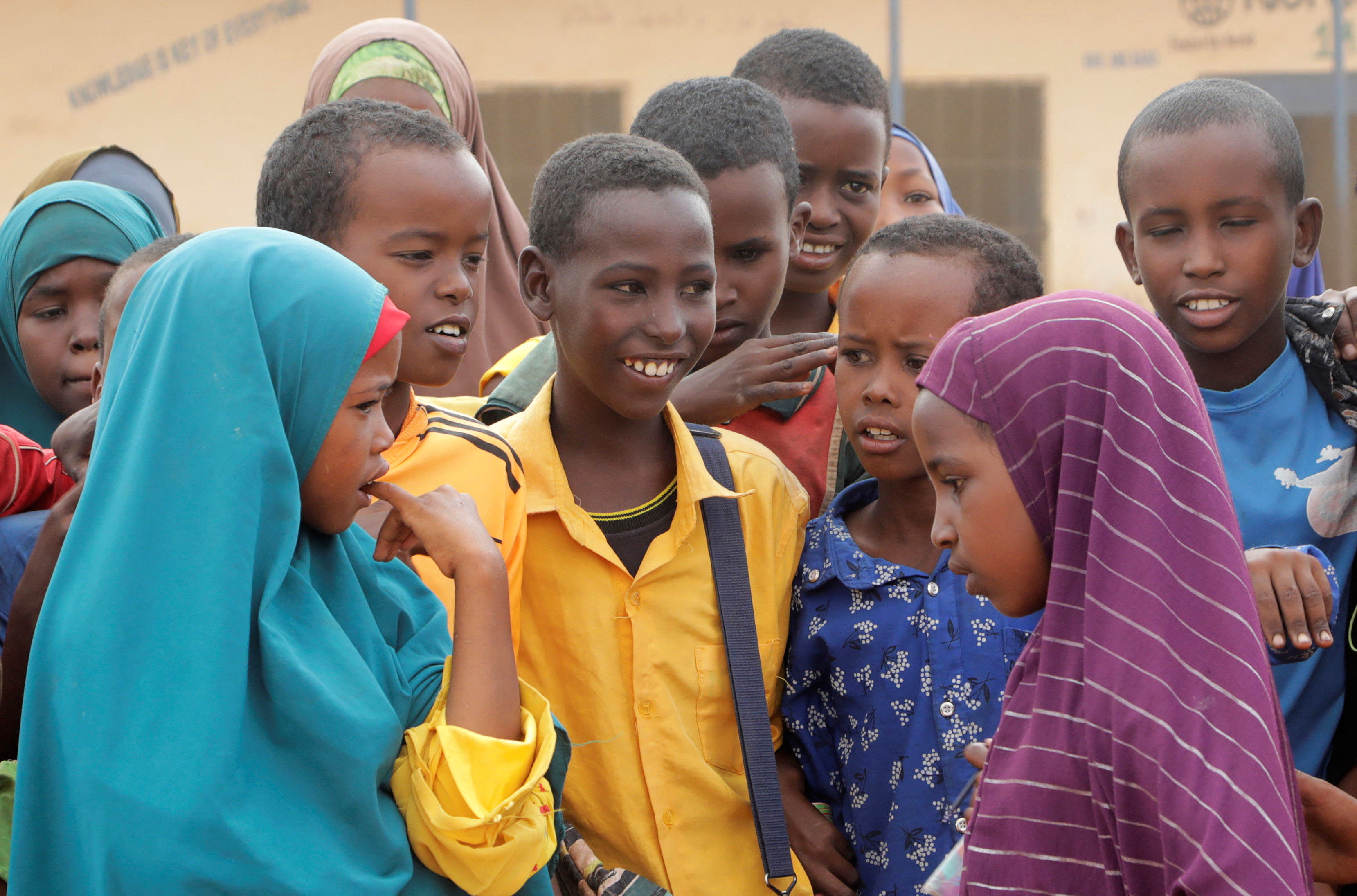 Kalmole Moalin Aden, 11, stands with classmates at the the Kabasa Primary School in Dollow