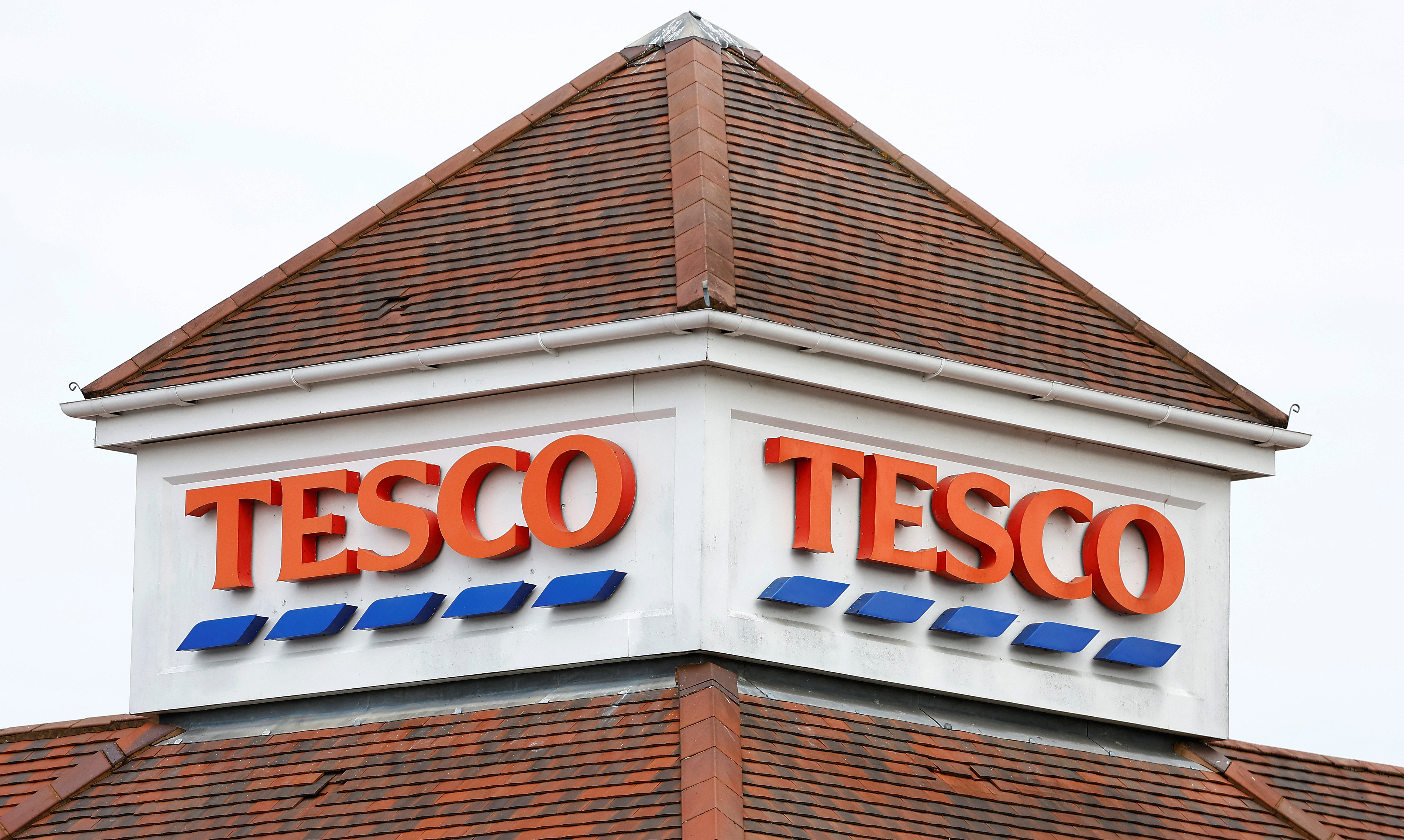 A TESCO sign is seen at a store in Weybridge
