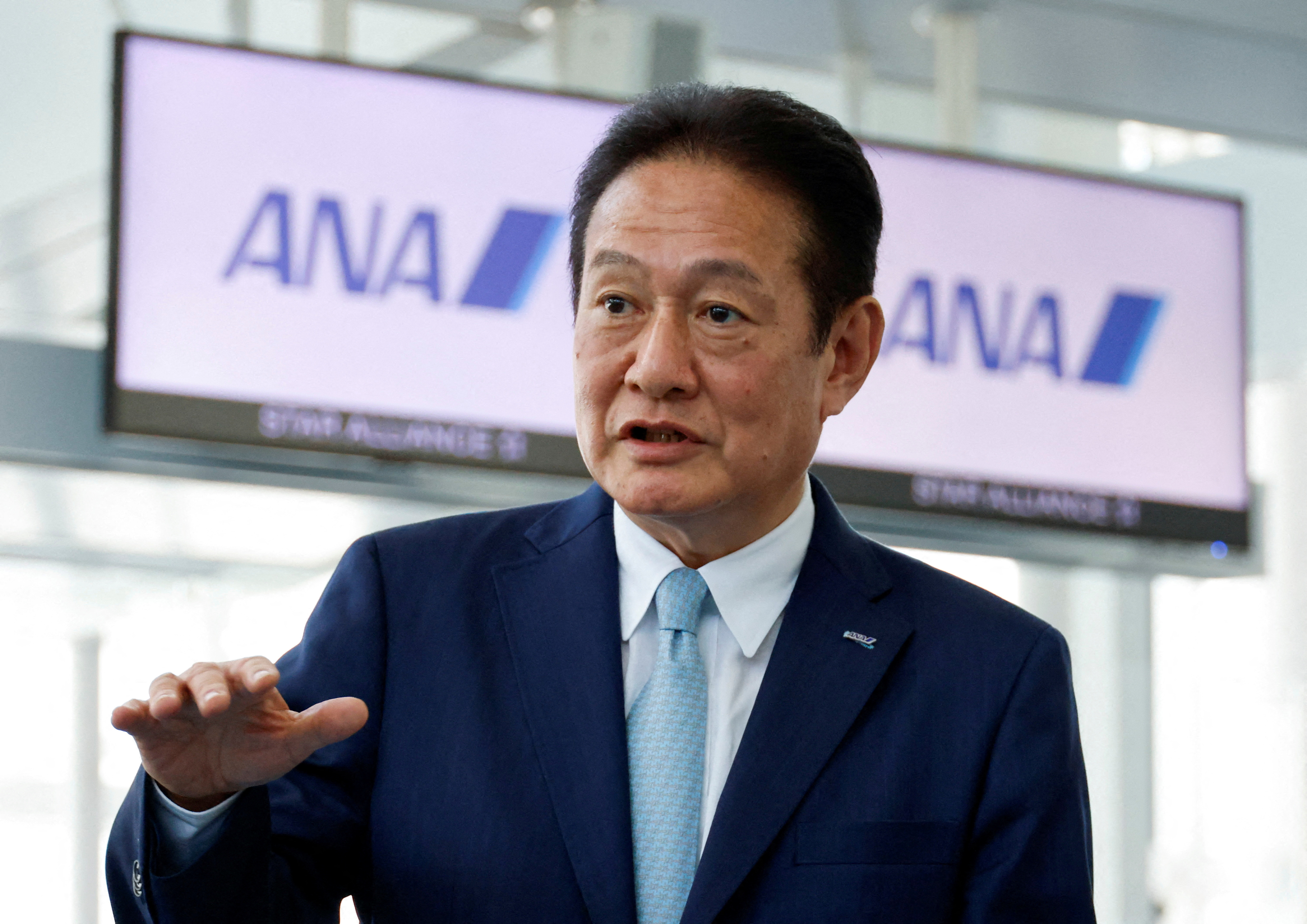All Nippon Airways President and CEO Shinichi Inoue speaks to media at Haneda Airport in Tokyo