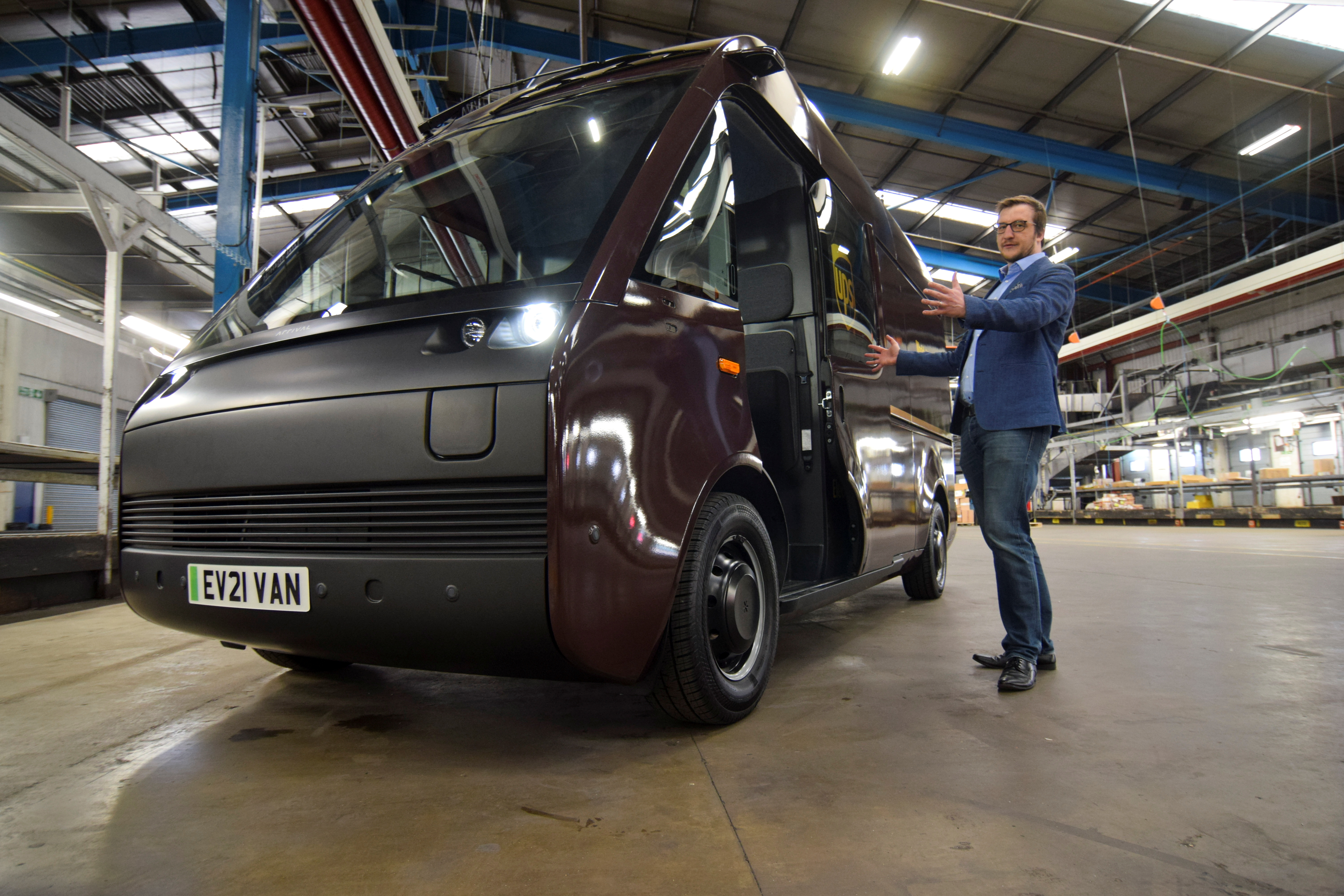 Luke Wake, UPS vice president of maintenance and engineering, demonstrates features on a test model of a fully-electric Arrival van, in London