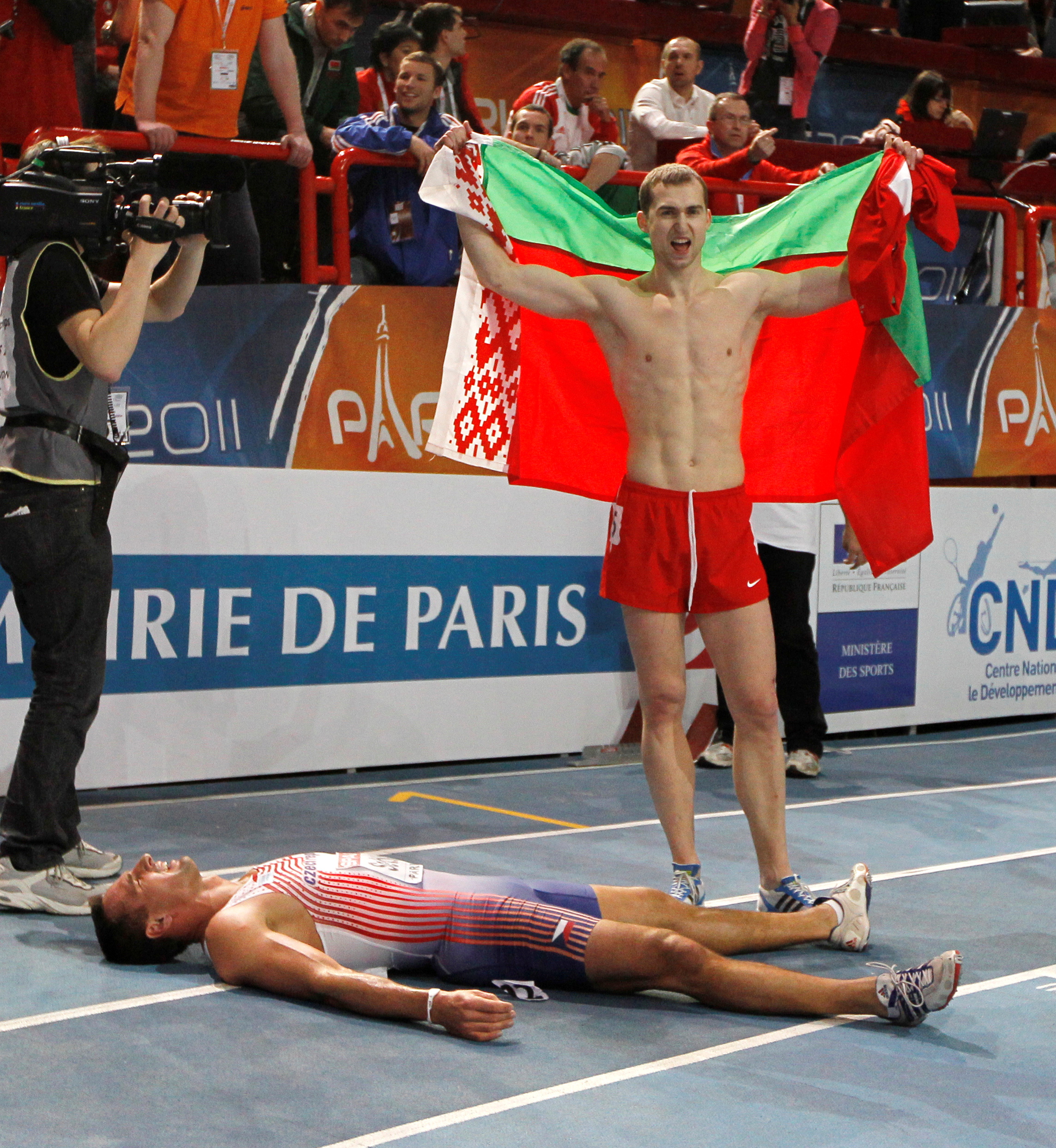 Belarus's Krauchanka and Czech Republic's Sebrle react after the men's Heptathlon event at the European Athletics indoor championships in Paris