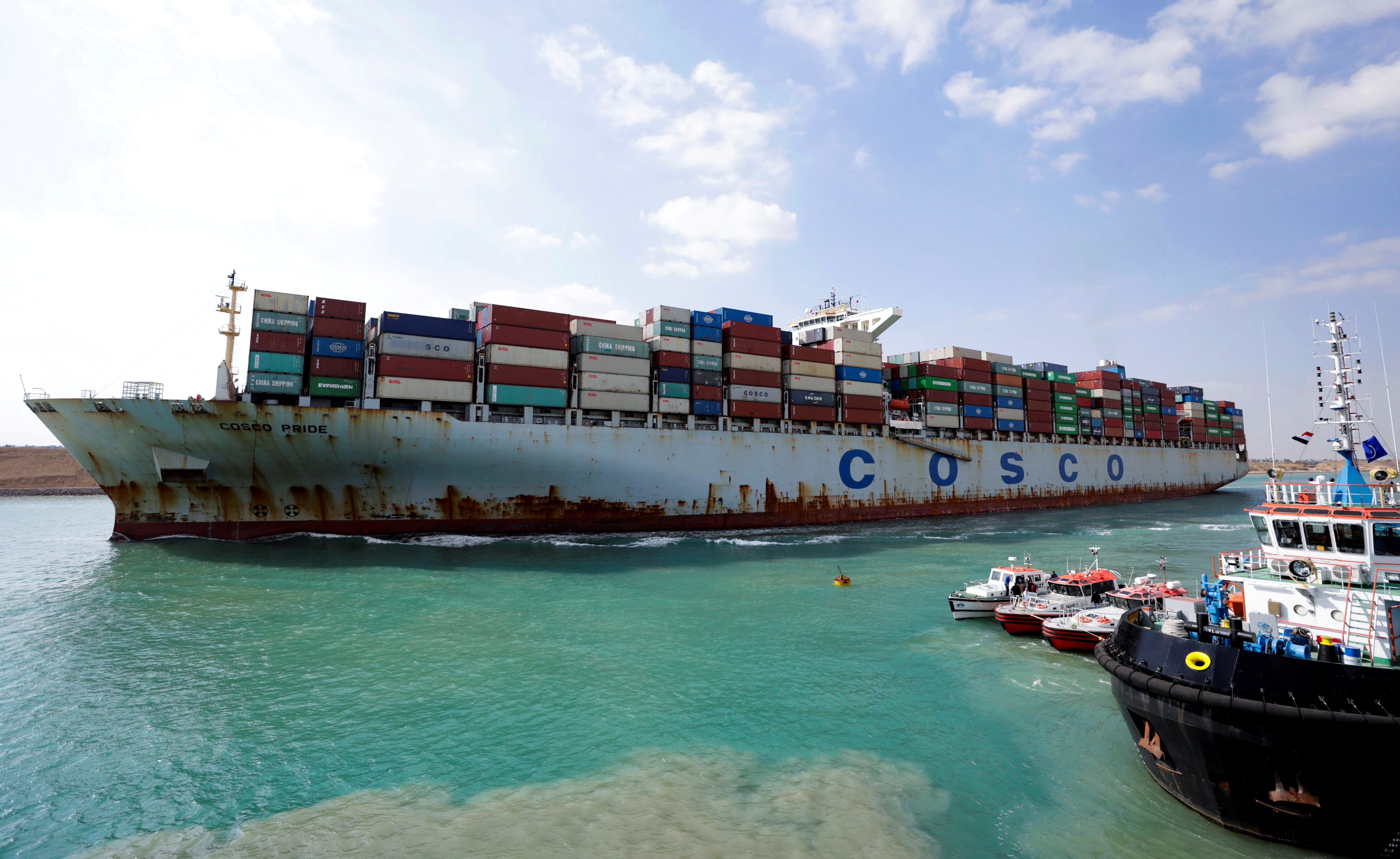 A shipping container of the China Ocean Shipping Company (COSCO) moves through the Suez Canal in Ismailia