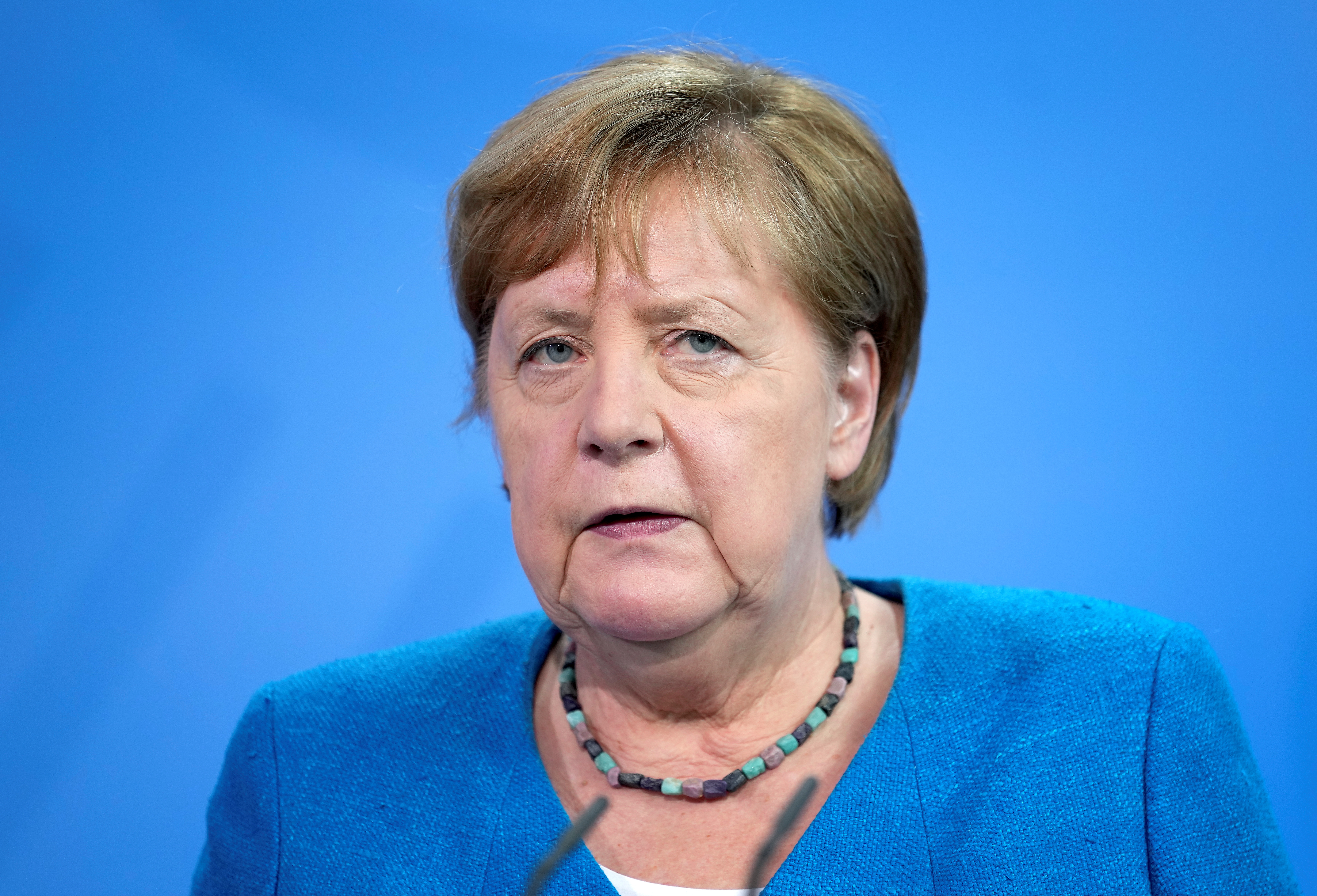 German Chancellor Angela Merkel addresses the media after a virtual summit, in Berlin