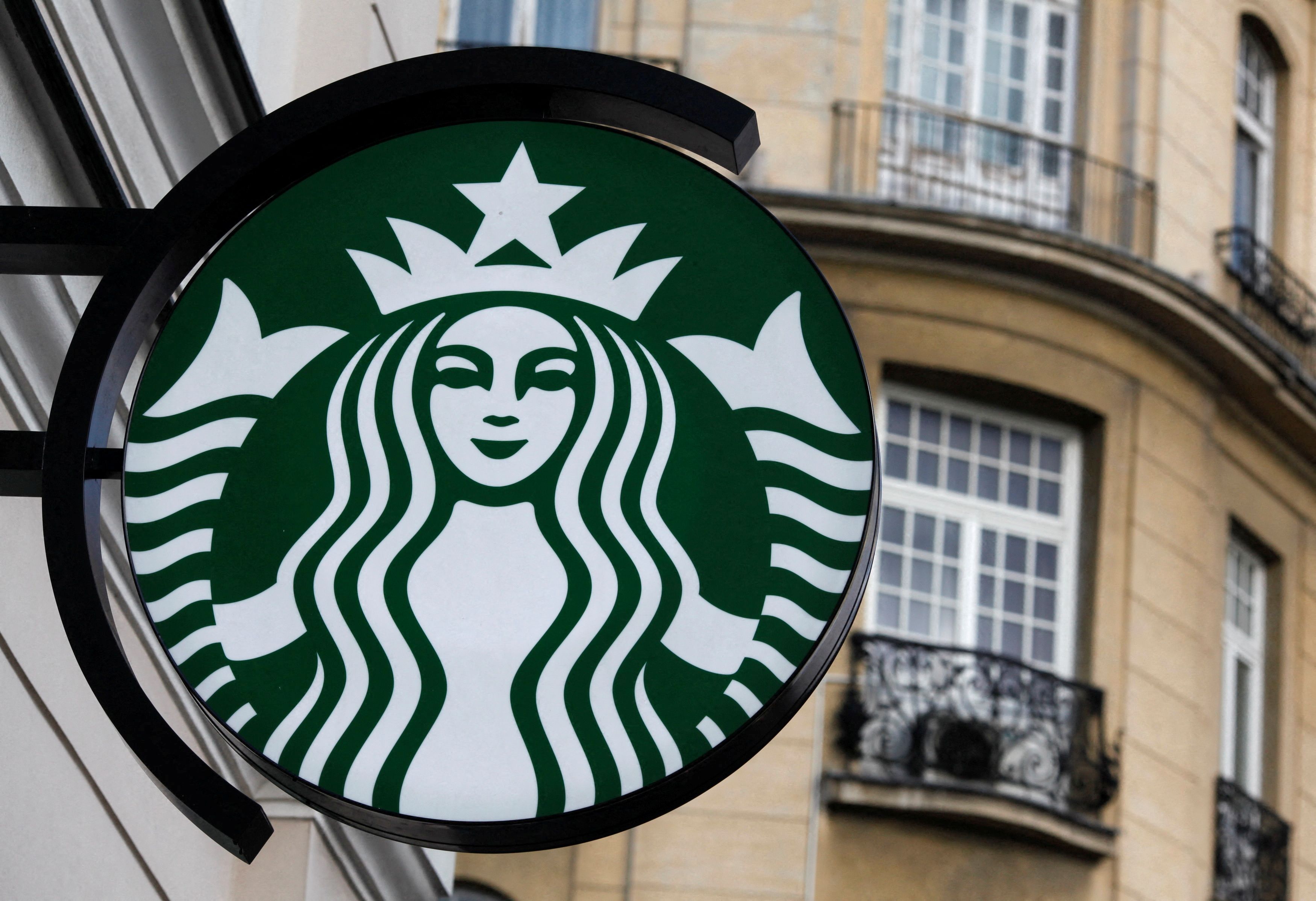 The Starbucks logo is seen outside the new Starbucks cafe in Warsaw