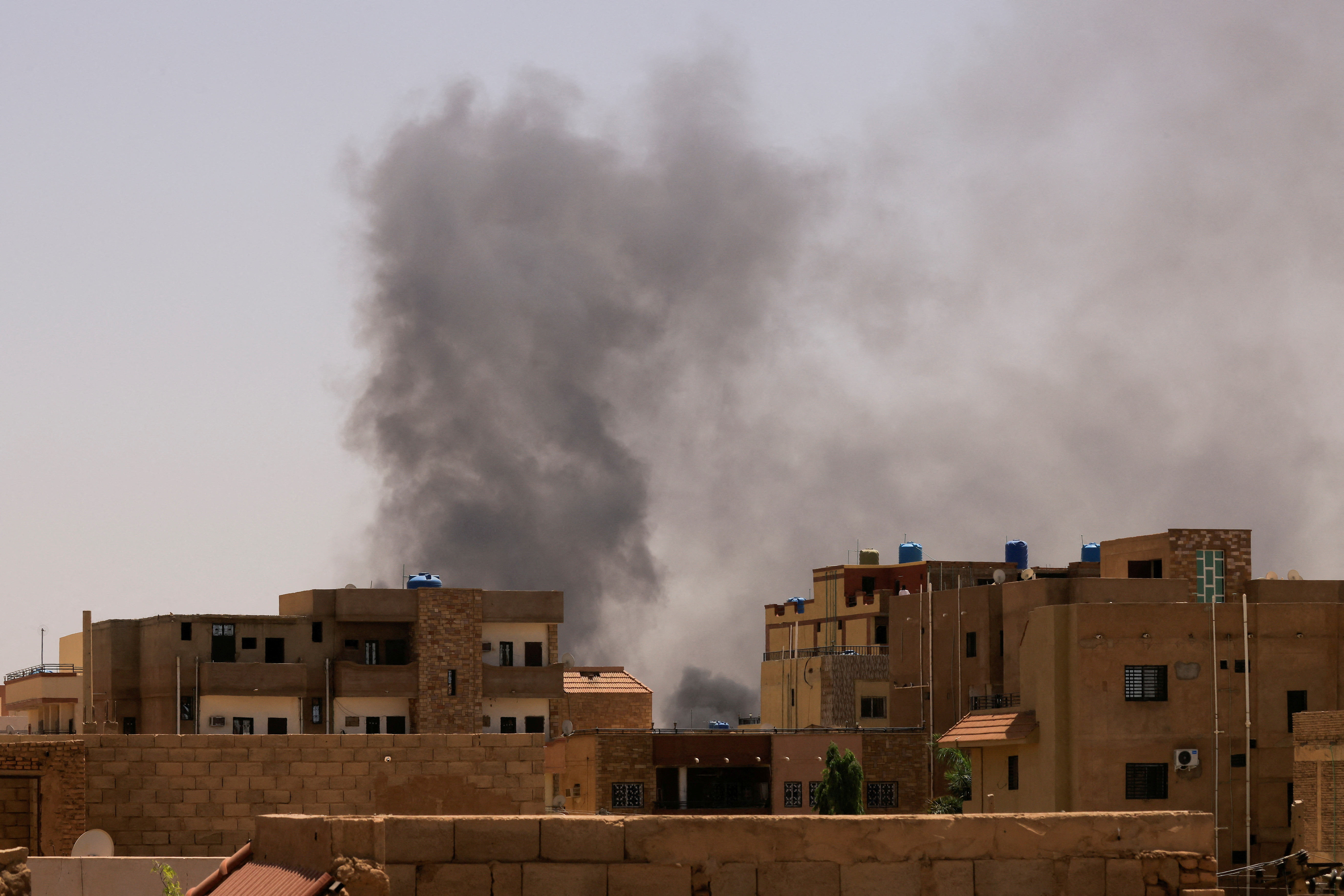 Smoke is seen rise from buildings in Khartoum North