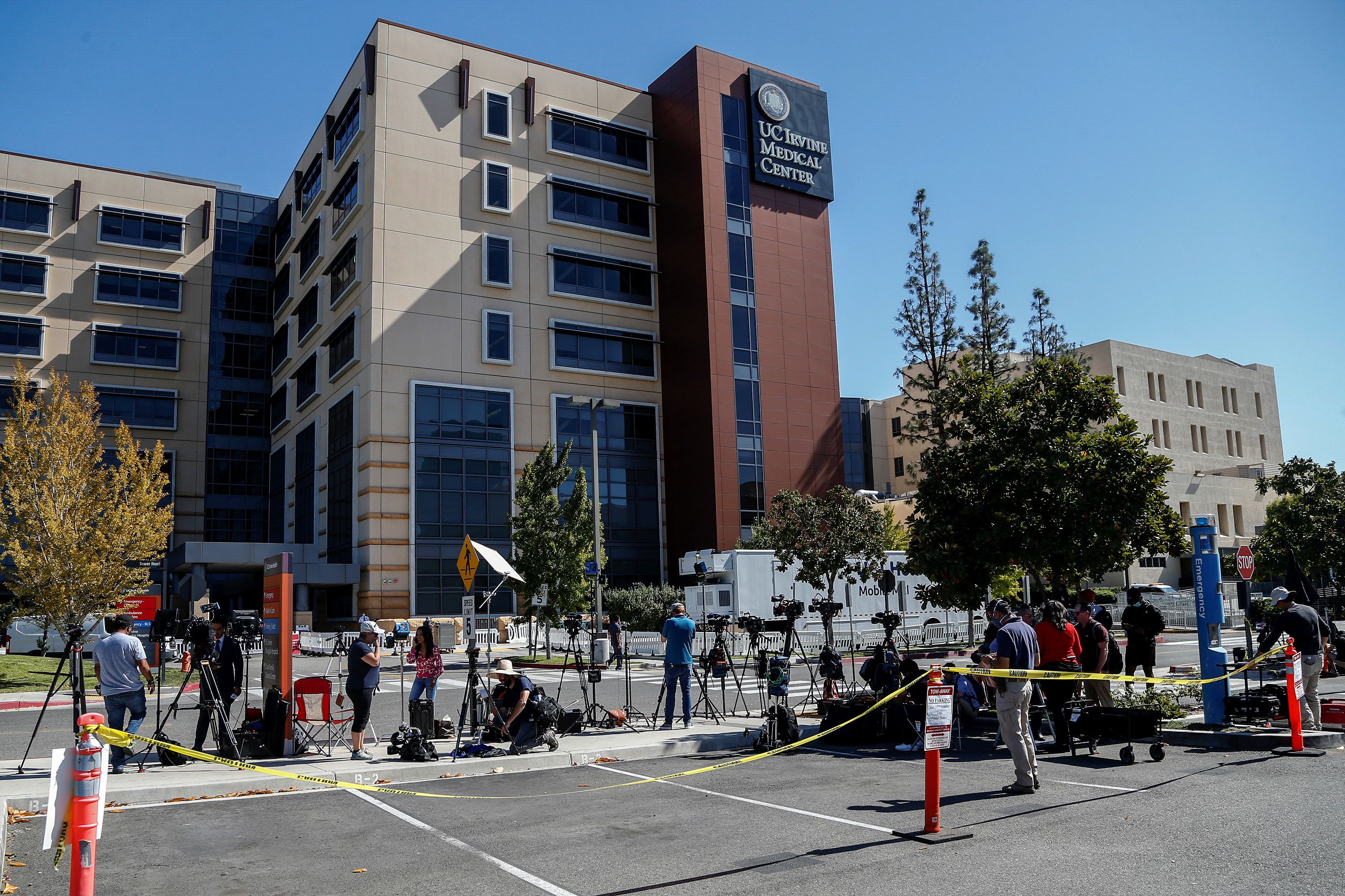 Members of media wait outside University of California Irvine Medical Center after it was announced that former U.S. President Bill Clinton was admitted to the hospital in Orange, California, U.S. October 15, 2021. REUTERS/Ringo Chiu