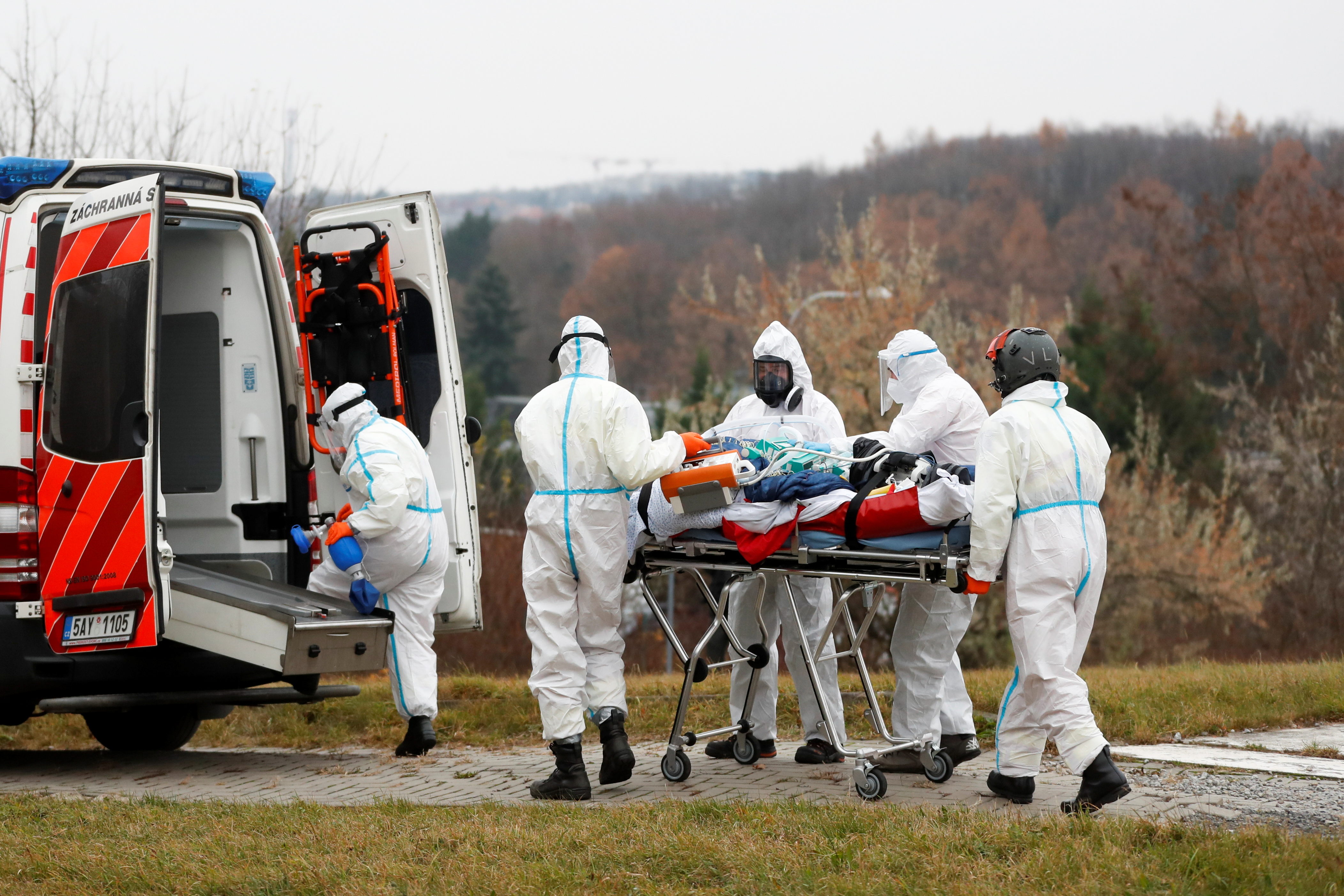 Medical workers transport a coronavirus disease (COVID-19) patient, who is being transferred from a Brno hospital, in Prague, Czech Republic, November 25, 2021. REUTERS/David W Cerny
