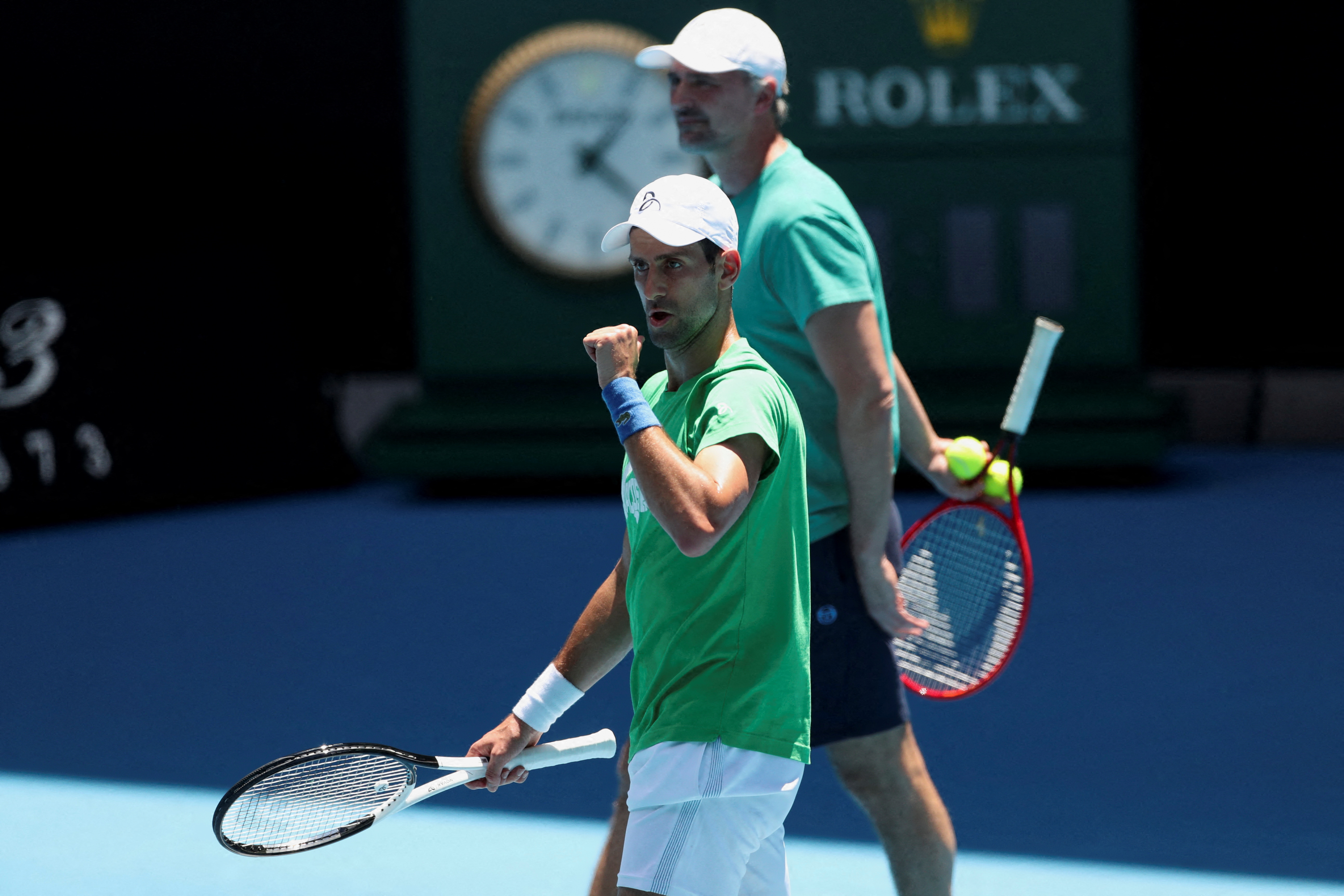 Djokovic practises for Australian Open as waits for visa ruling | Reuters