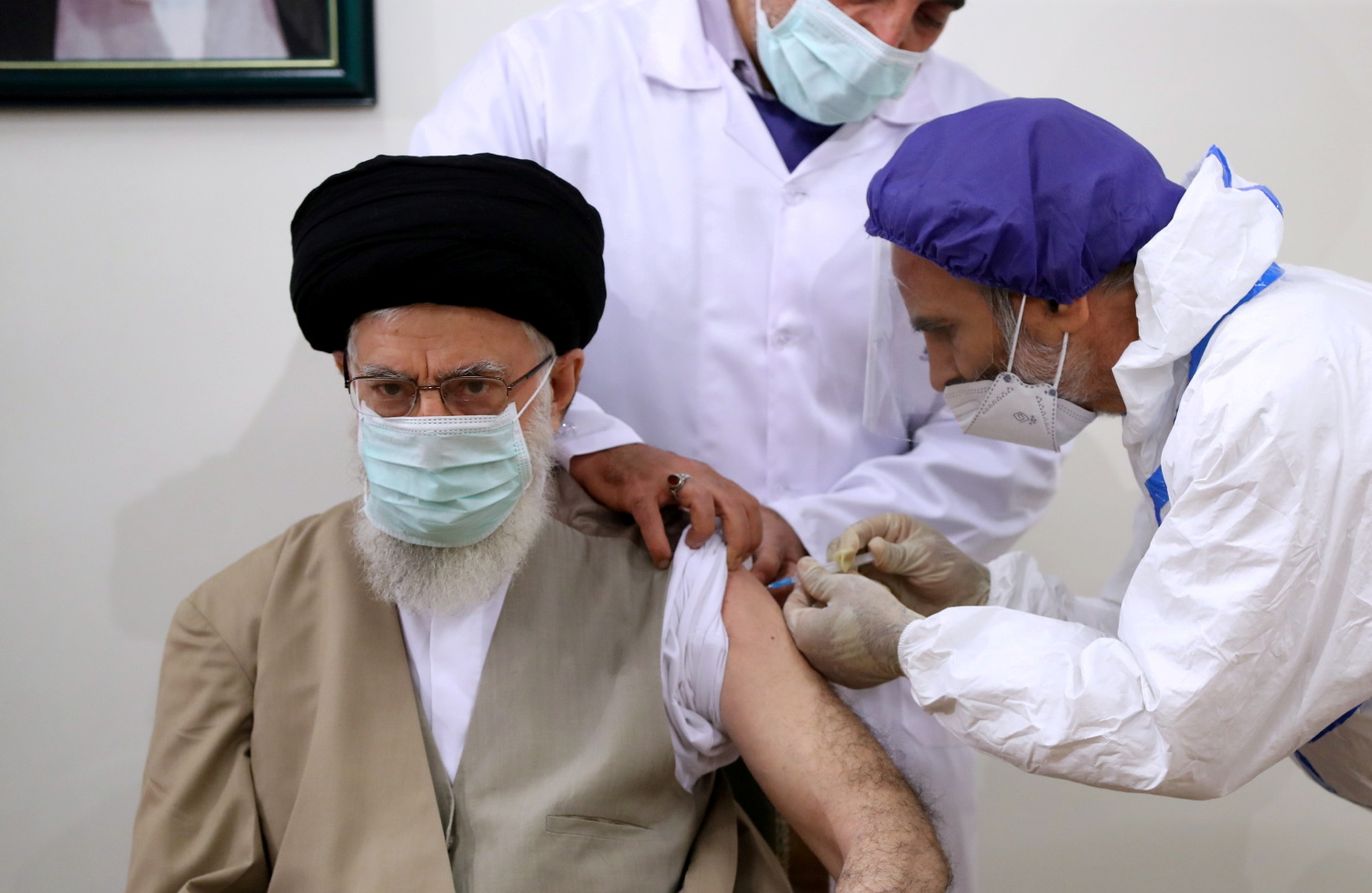 Iran's Supreme Leader Ayatollah Ali Khamenei receives his first dose of the COVIran Barakat vaccine, in Tehran
