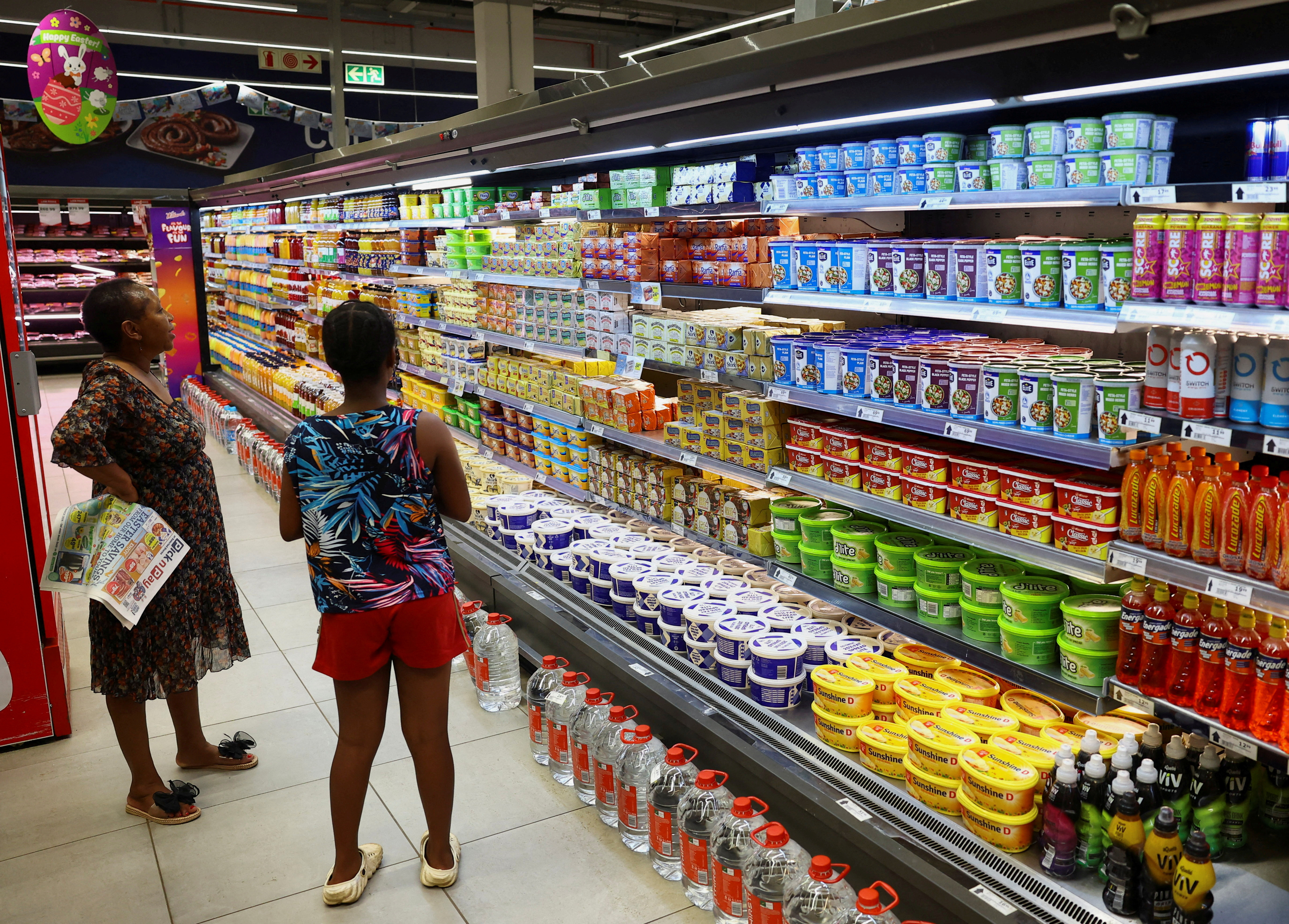 Shoppers stand at a Pick n Pay store in Soweto