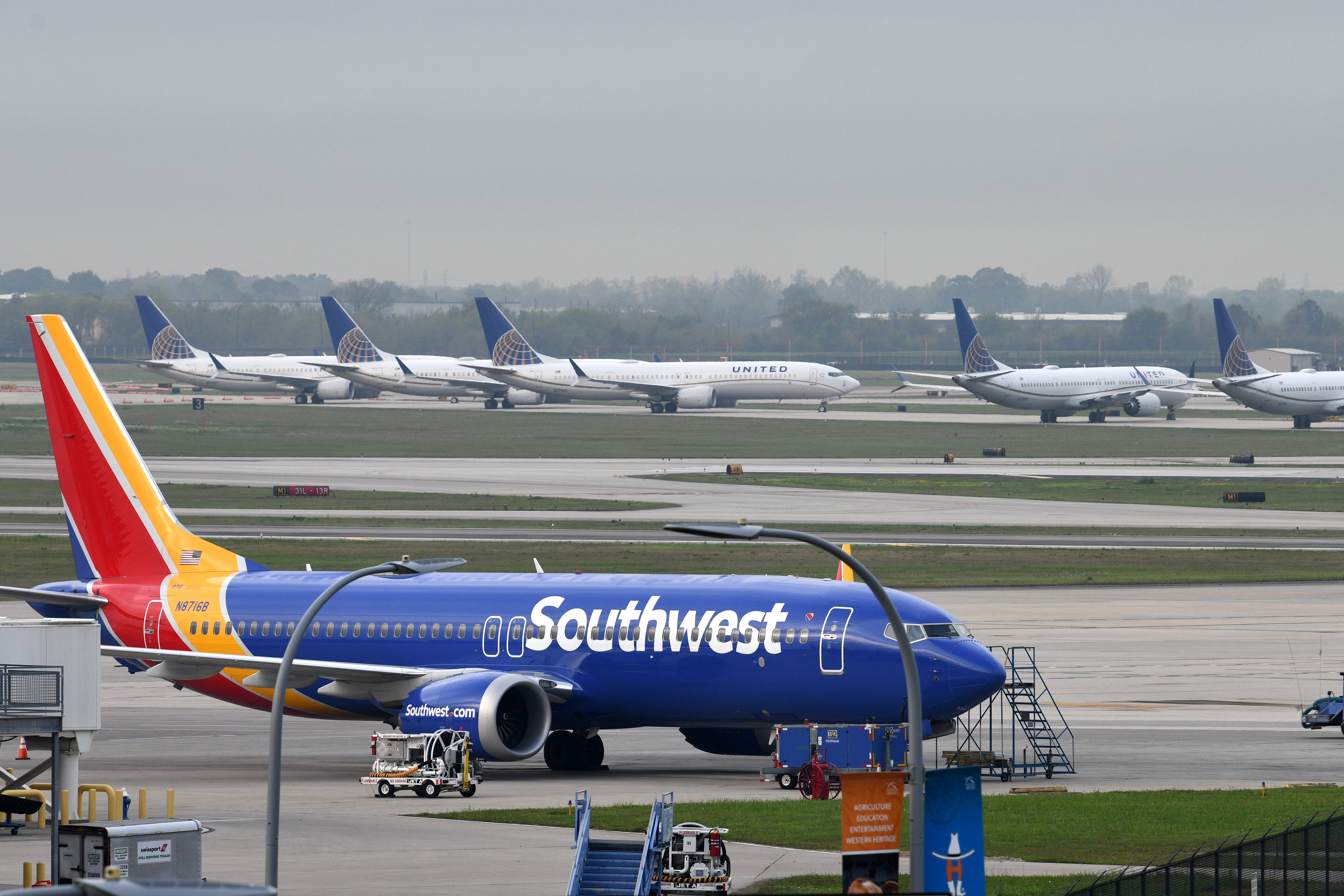 A Southwest Airlines Boeing 737 MAX 8 aircraft is pictured in front of United Airlines planes, including Boeing 737 MAX 9 models, at William P. Hobby Airport in Houston