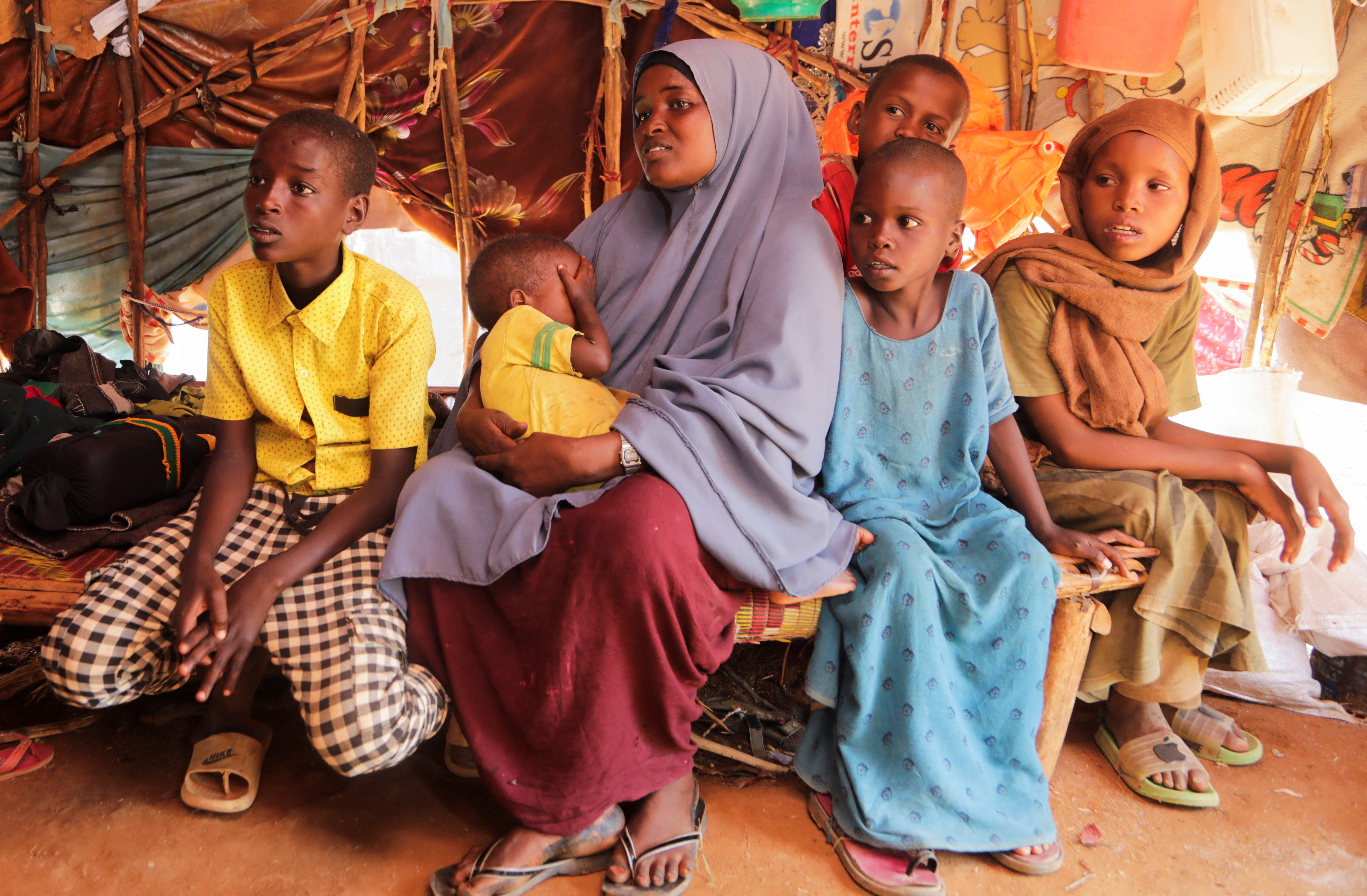 Bashir Nur Salat sits with his mother Meerey Madeey and her siblings during a Reuters interview in Dollow, Gedo Region
