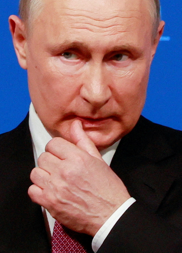 Russian President Vladimir Putin holds a news conference
