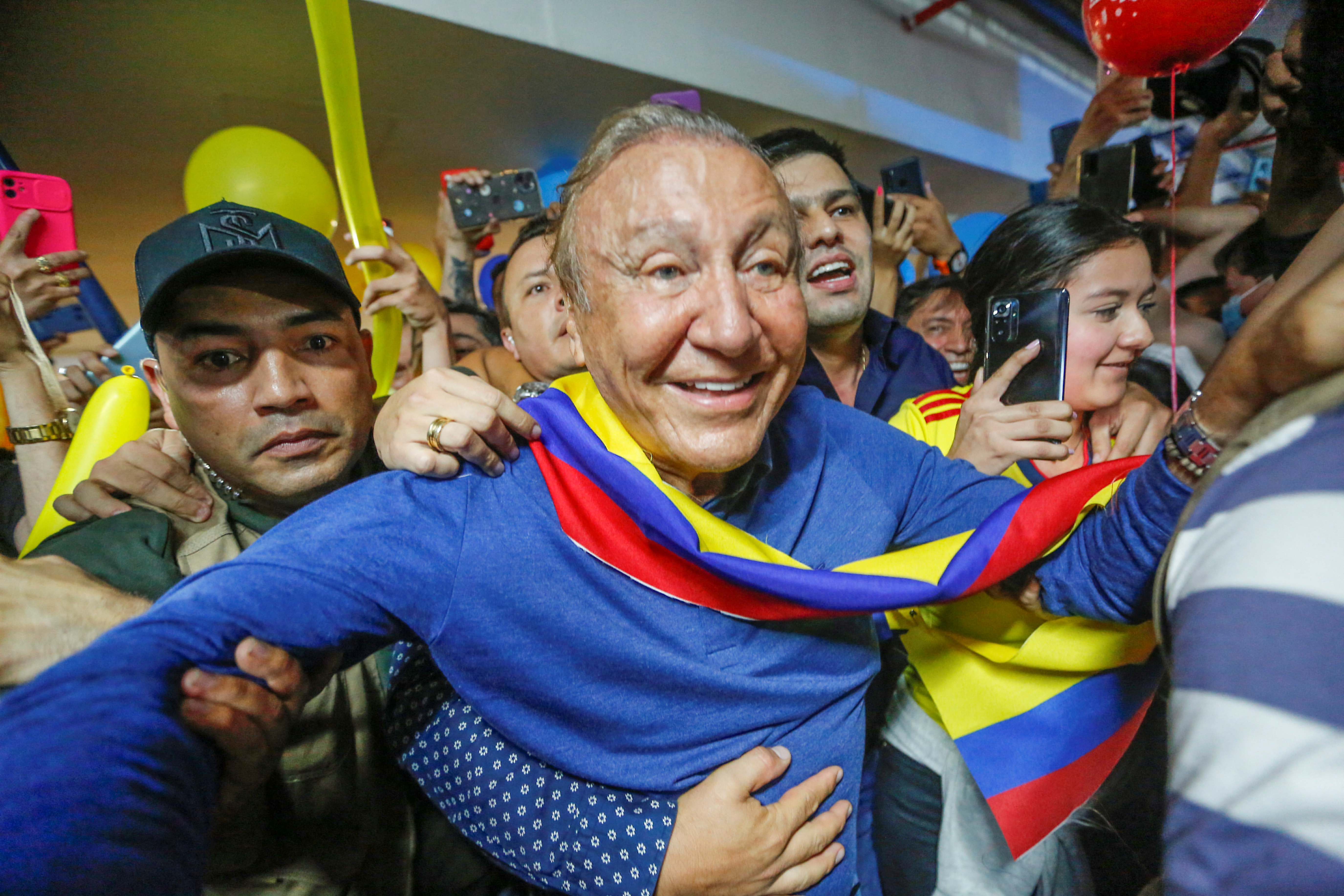 Colombian centre-right presidential candidate Rodolfo Hernandez of Anti-Corruption Rulers' League Party greets his supporters after his arrival at Palonegro International Airport in Bucaramanga