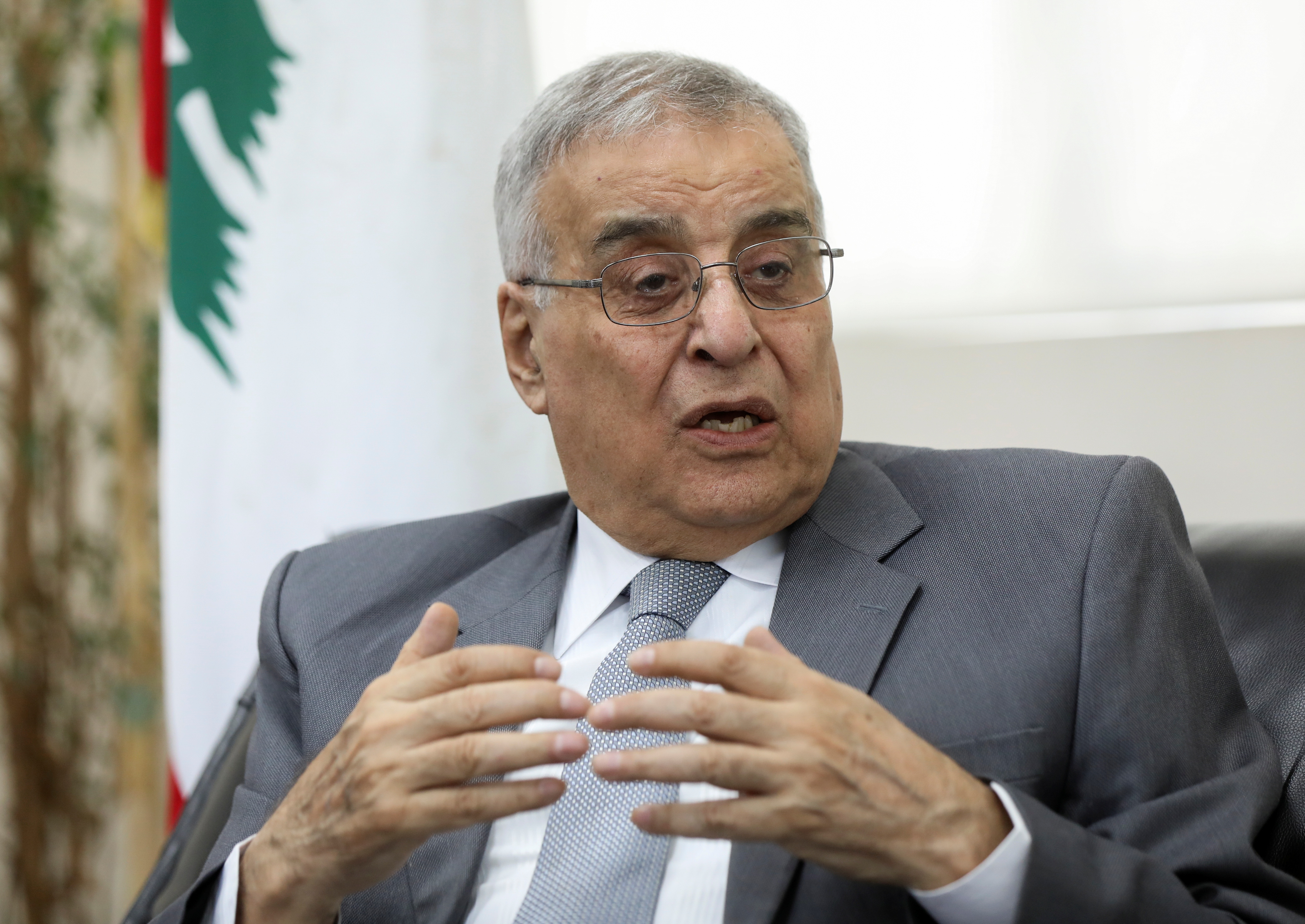 Lebanese Foreign Minister Abdallah Bou Habib gestures as he speaks during an interview with Reuters in Beirut
