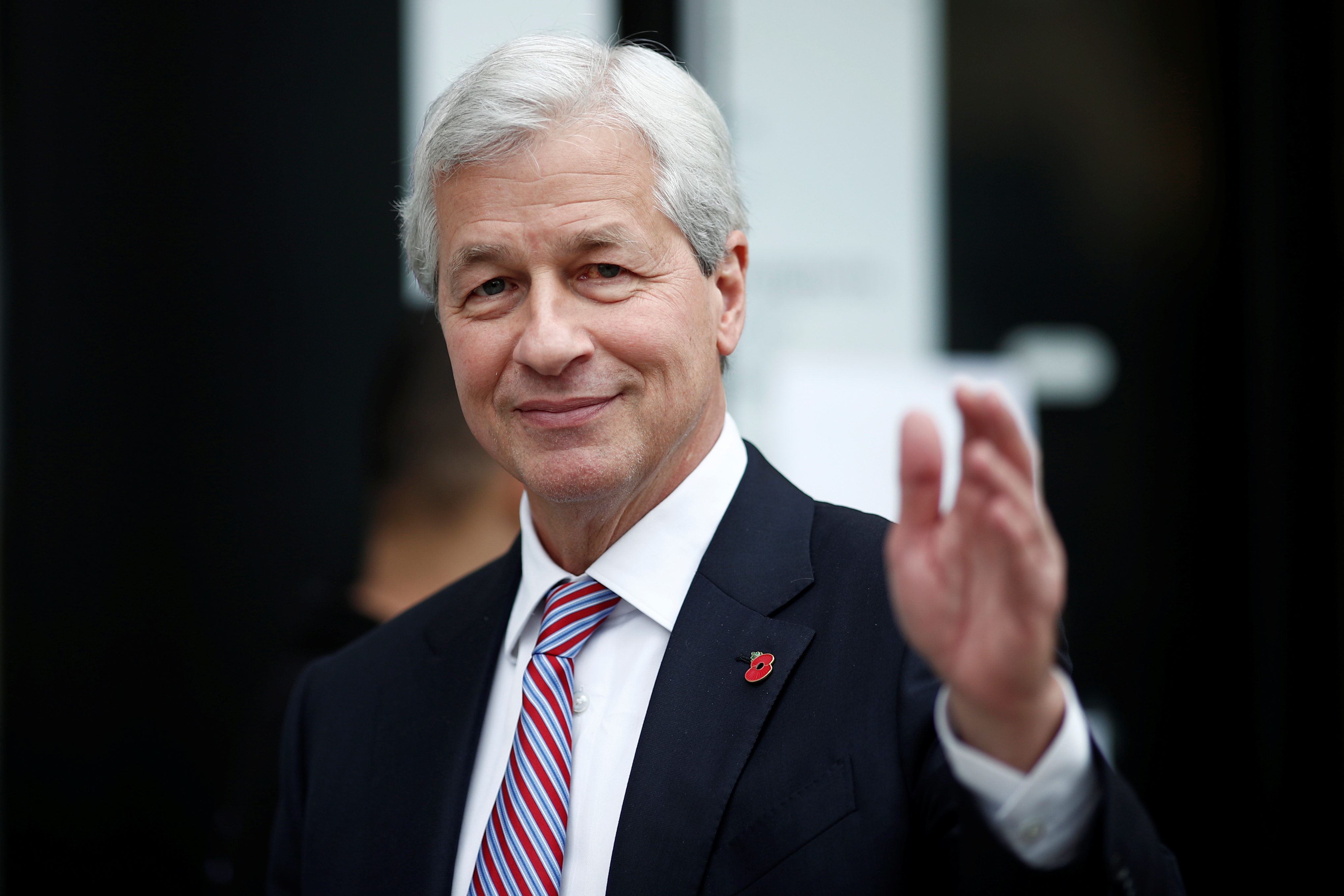 Jamie Dimon, CEO of JPMorgan Chase, leaves after the launching of the Advancing Cities Challenge, in Pantin