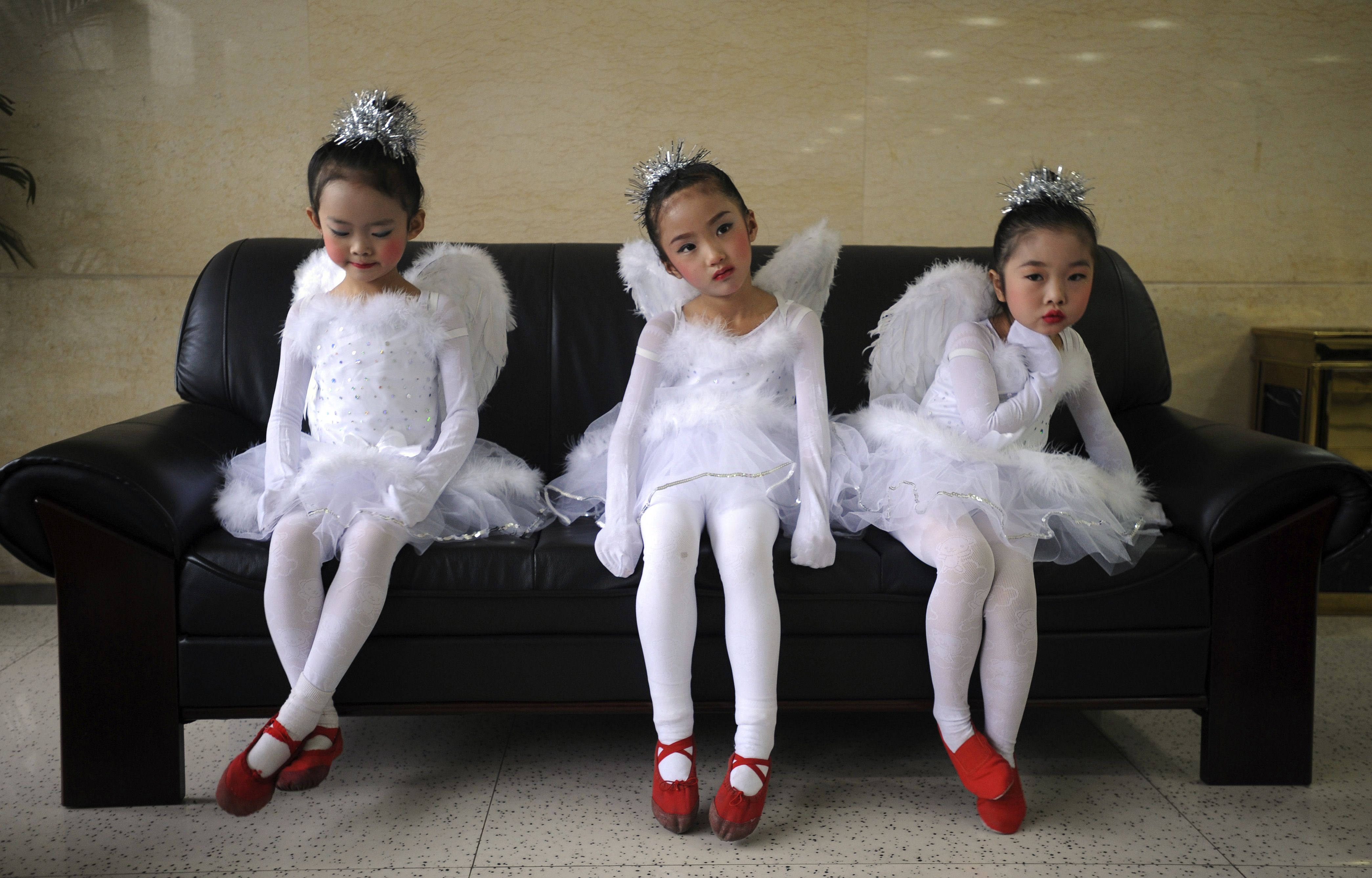Children wait to perform ballet for a promotional event in Kunming