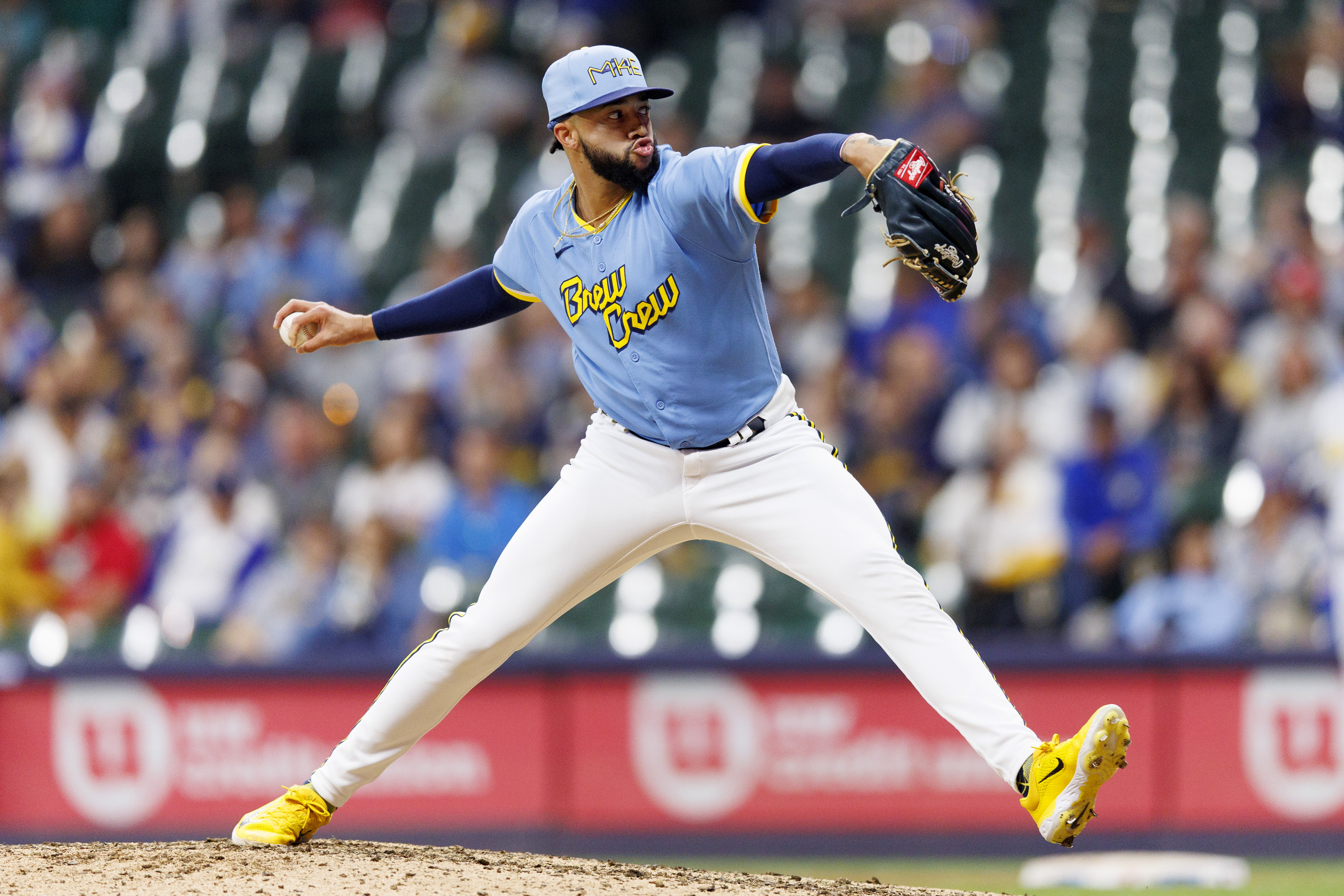 Milwaukee Brewers' Devin Williams pauses before pitching during