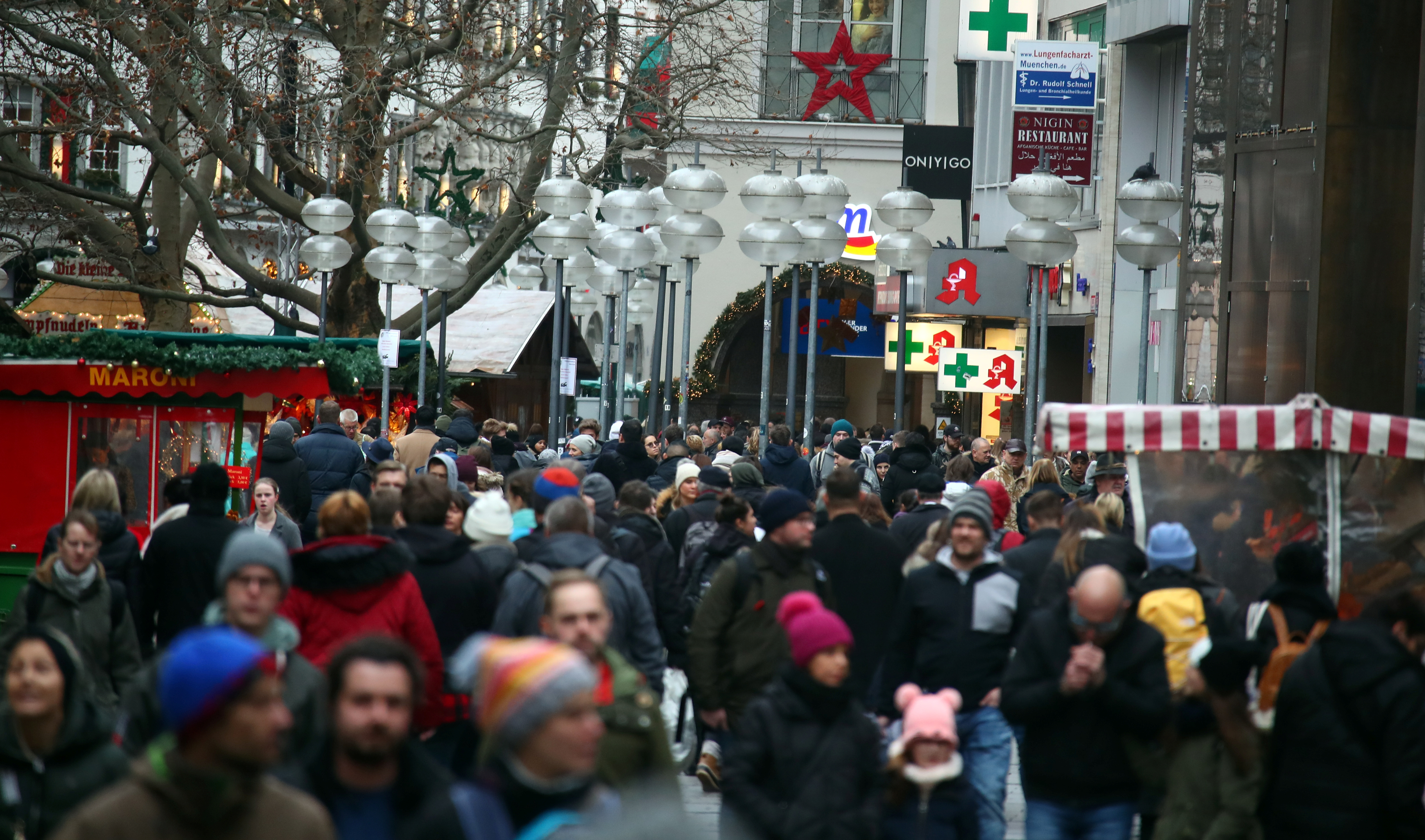 People stroll at Munich's main shopping street ahead of the Christmas celebrations in Munich