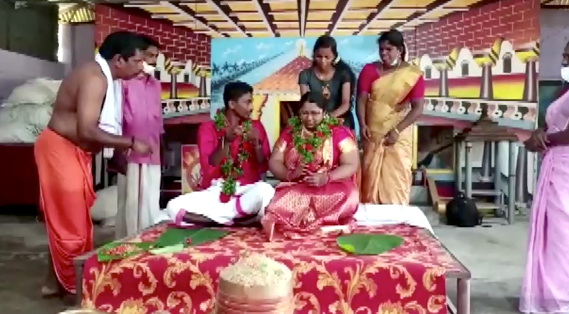 Floods force Indian couple to float to their wedding - in a cooking pot |  Reuters