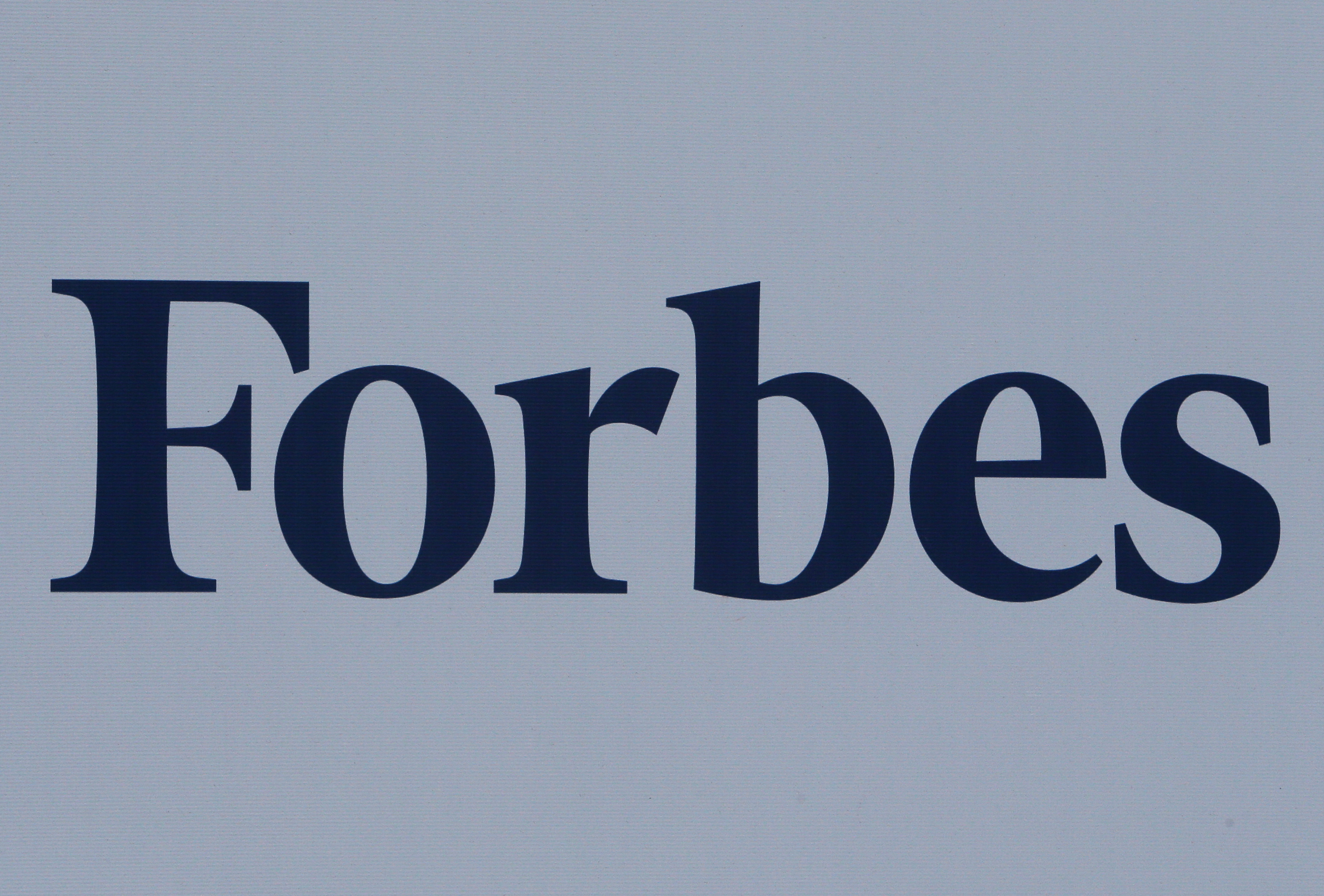 The logo of Forbes magazine is seen on a board in 2017