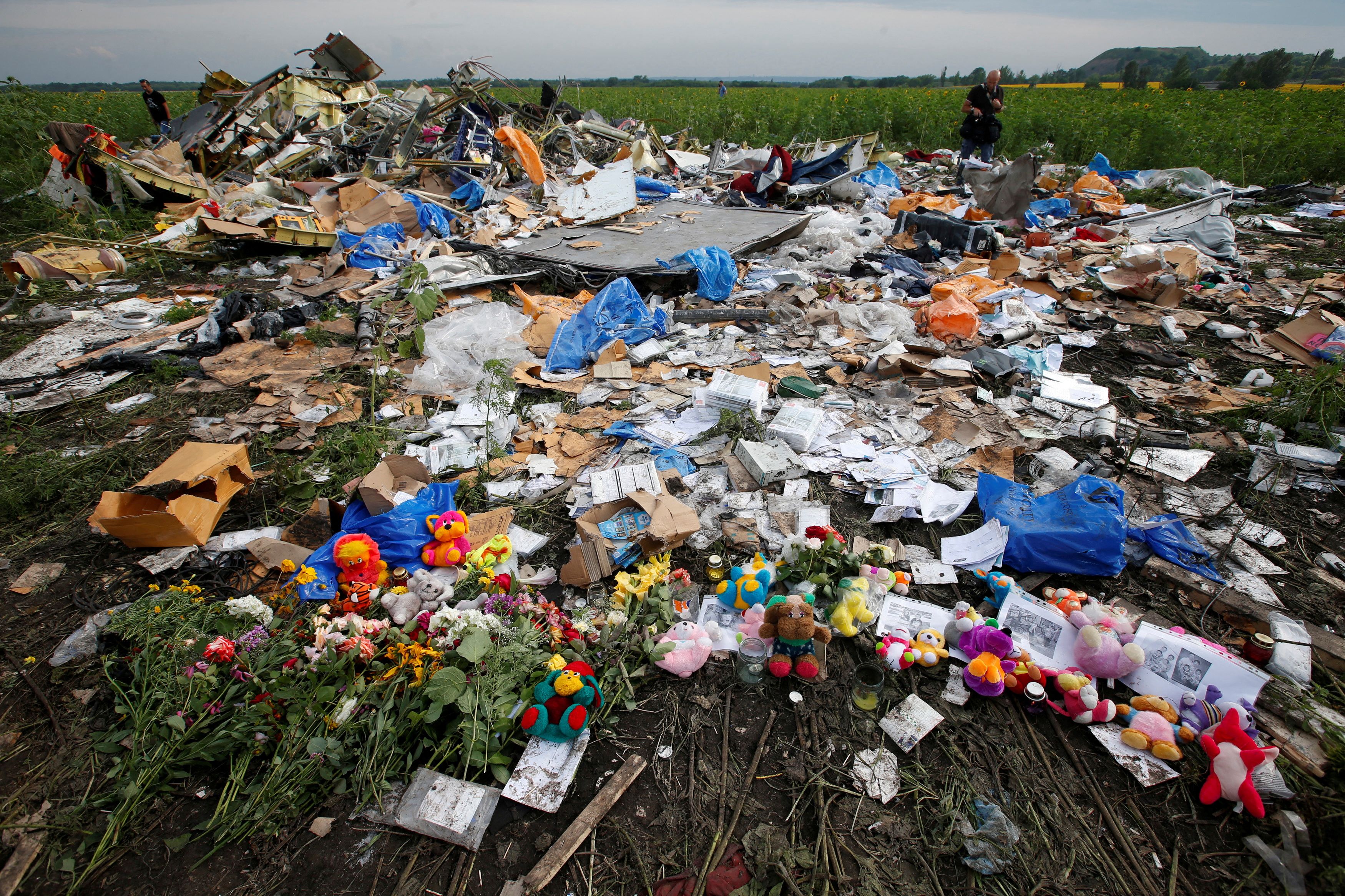Flowers and mementos left by local residents at the crash site of Malaysia Airlines Flight MH17