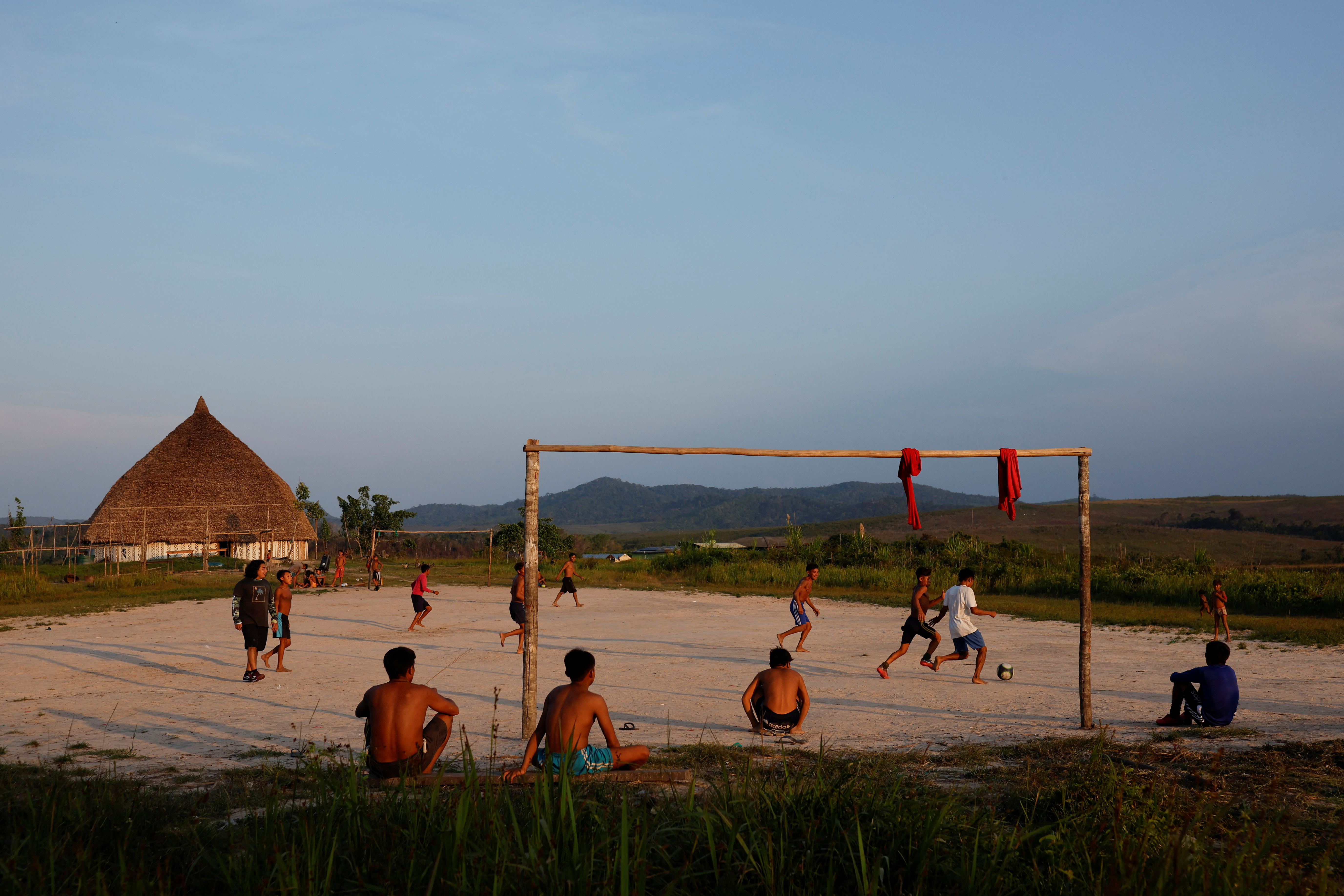 Yanomami indigenous people play football at Surucucu village, in Yanomami indigenous land