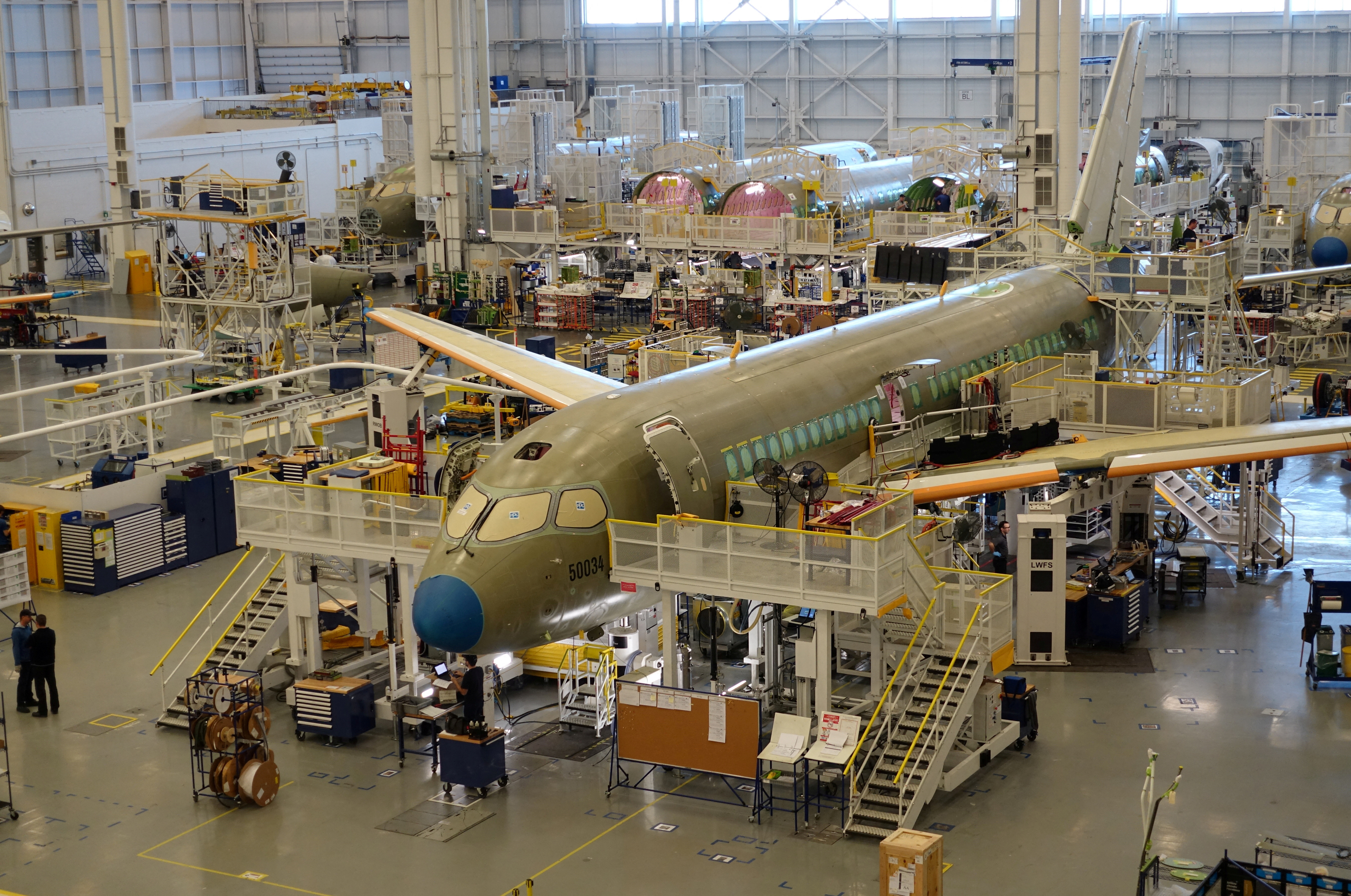 An Airbus A220 passenger jet stands in the final assembly line, where the European company plans a $30 million investment to keep up with forecast demand