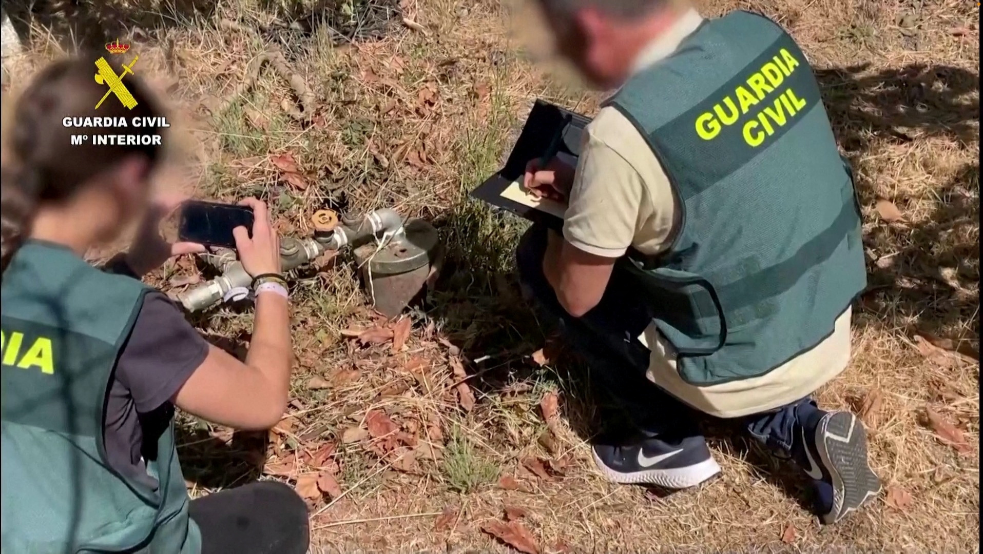 Spanish police officers document illegal water pipes in Malaga province