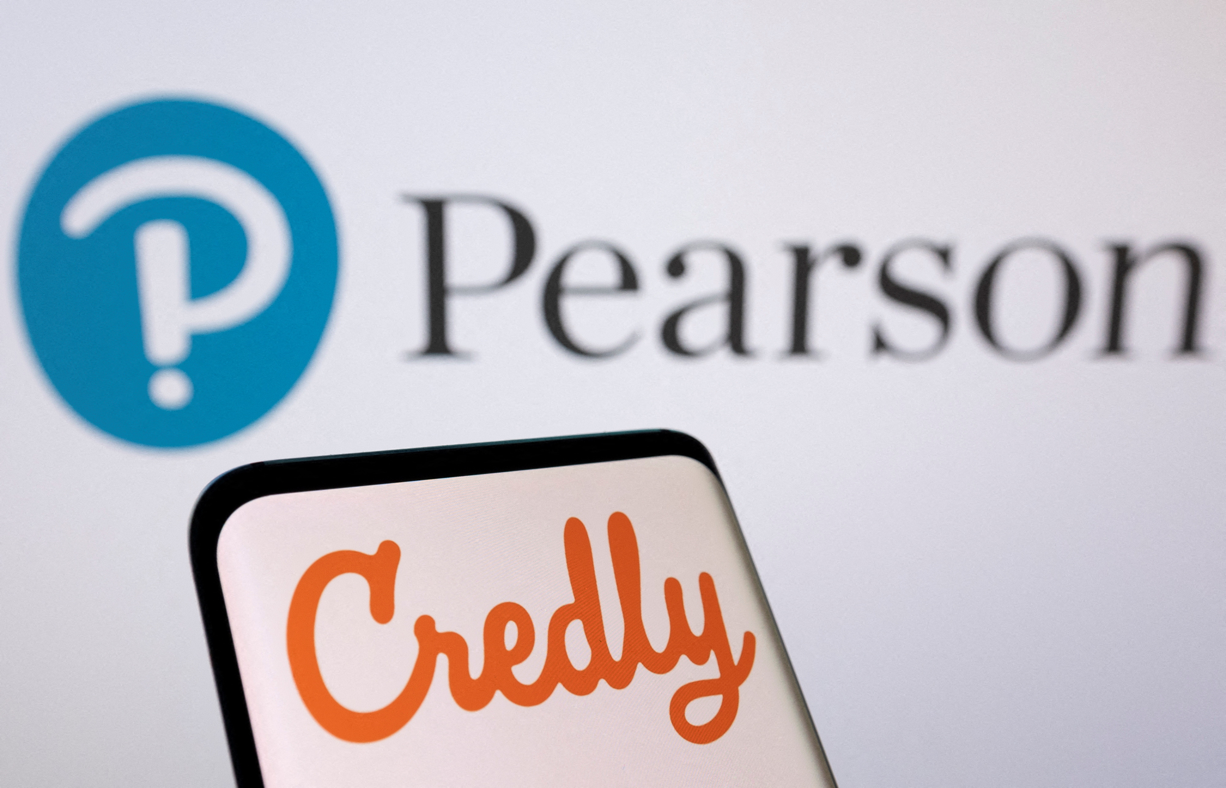 Illustration shows Pearson and Credly logos