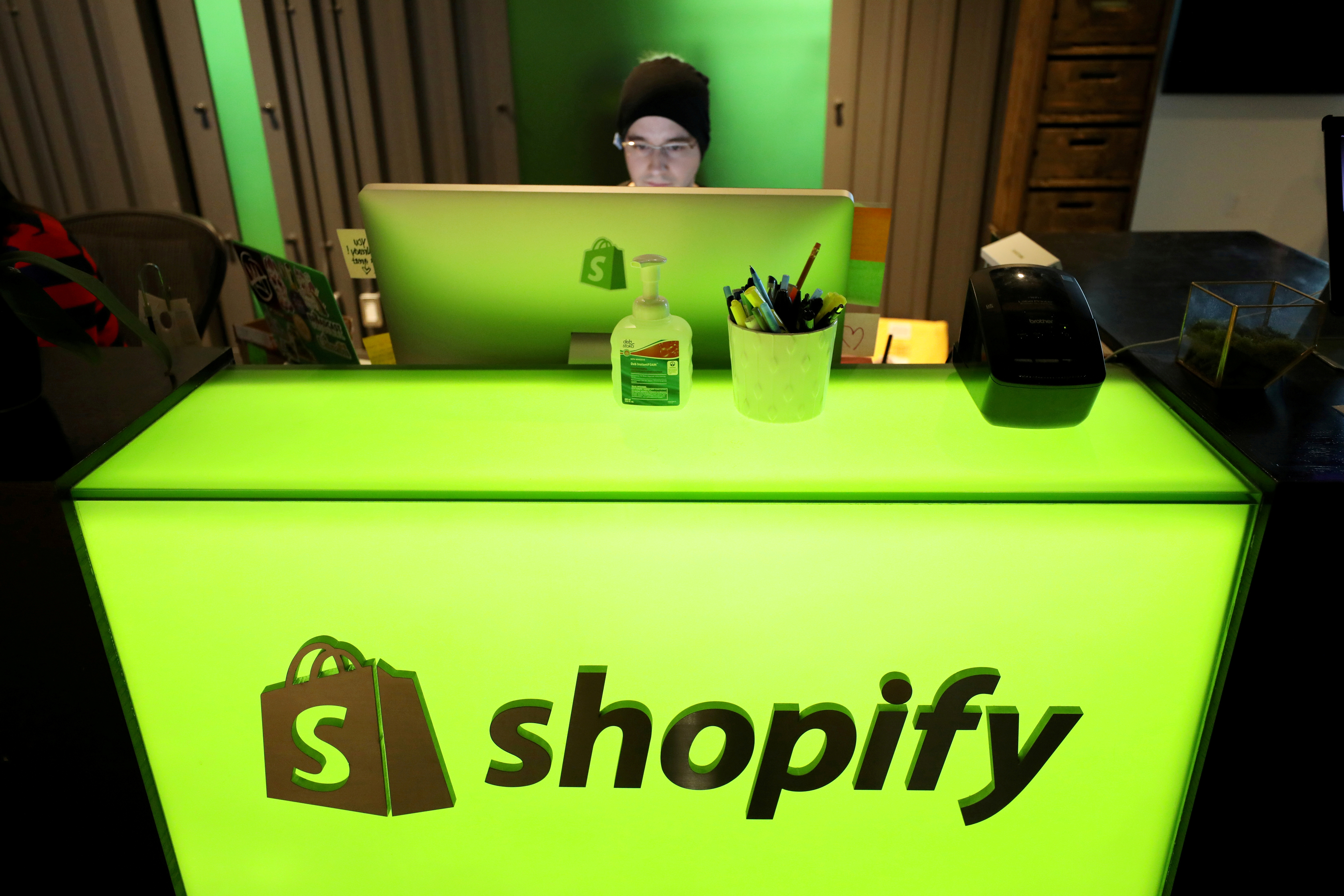 FILE PHOTO: An employee works at Shopify's headquarters in Ottawa