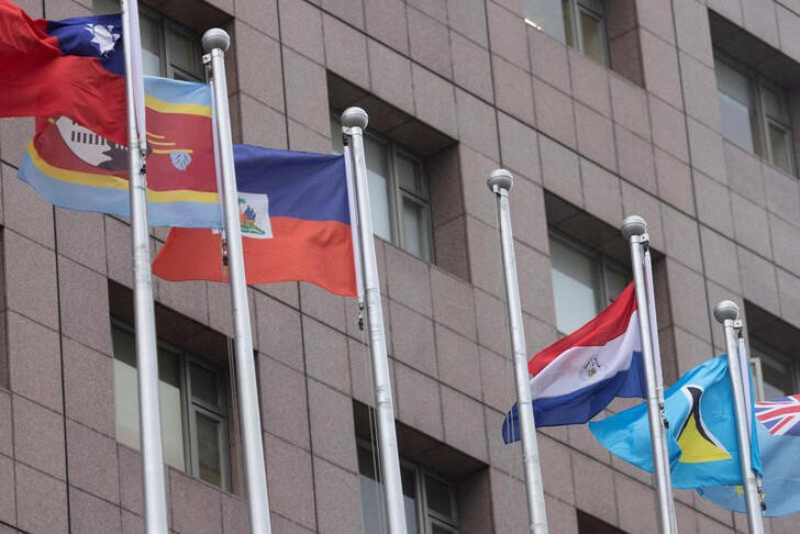 An empty flag pole where Nauru's flag used to fly is pictured next to flags of other countries at the Diplomatic Quarter which houses embassies in Taipei