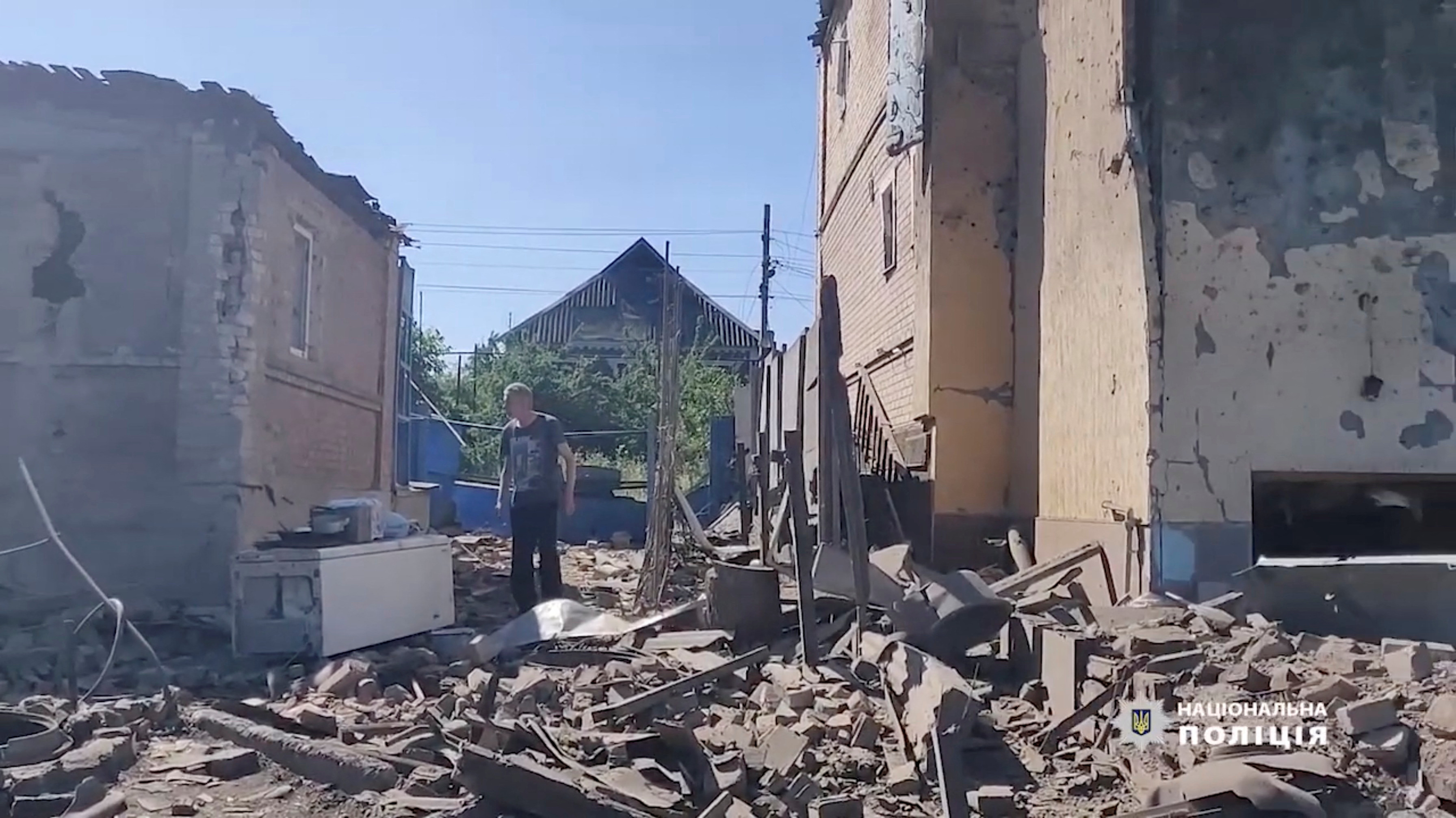 A man walks in the rubble near damaged buildings, as Russia's invasion of Ukraine continues, in Bakhmut