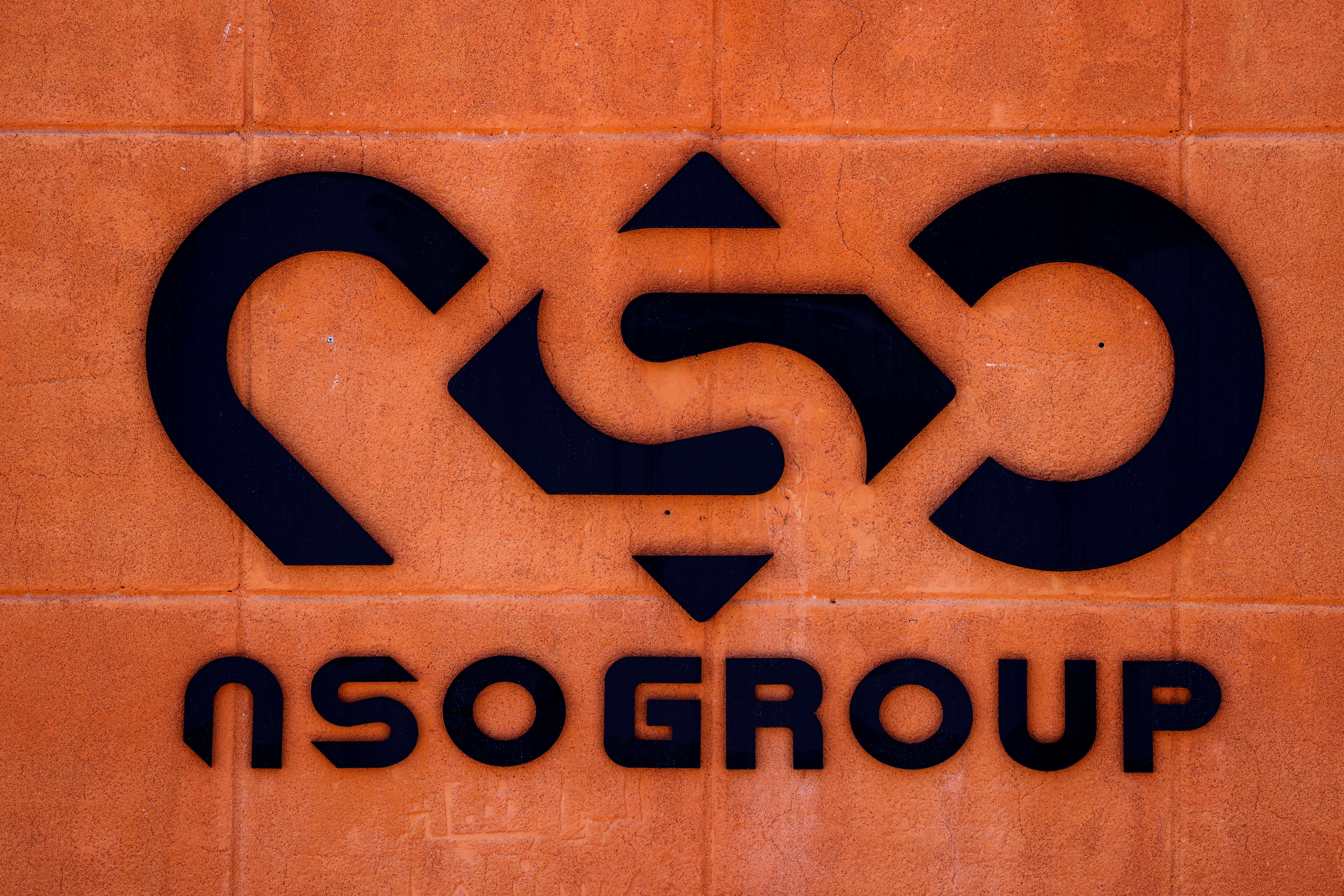 The logo of Israeli cyber firm NSO Group is seen at one of its branches in the Arava Desert, southern Israel July 22, 2021. REUTERS/Amir Cohen
