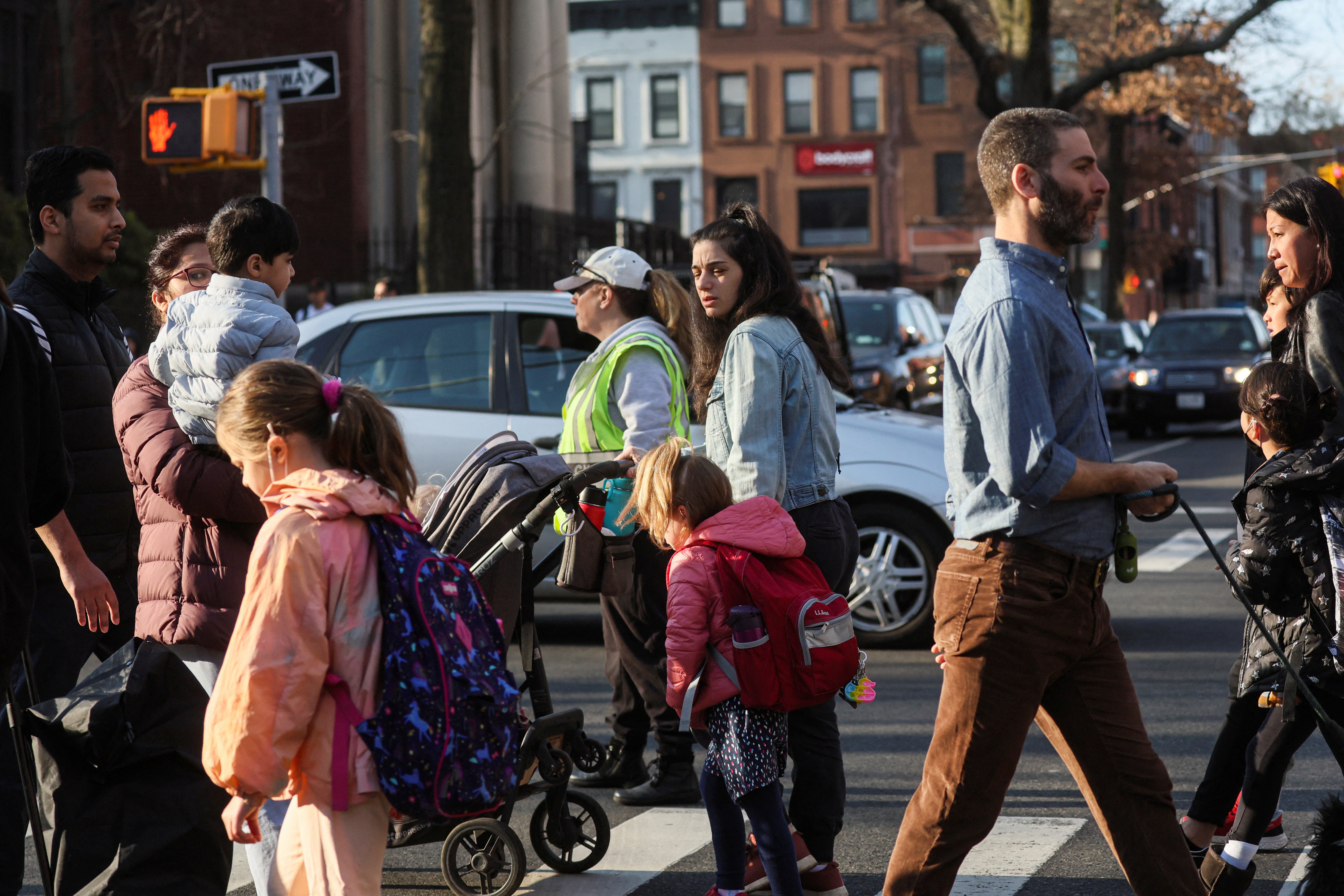 Children are seen walking to school in Brooklyn, New York City