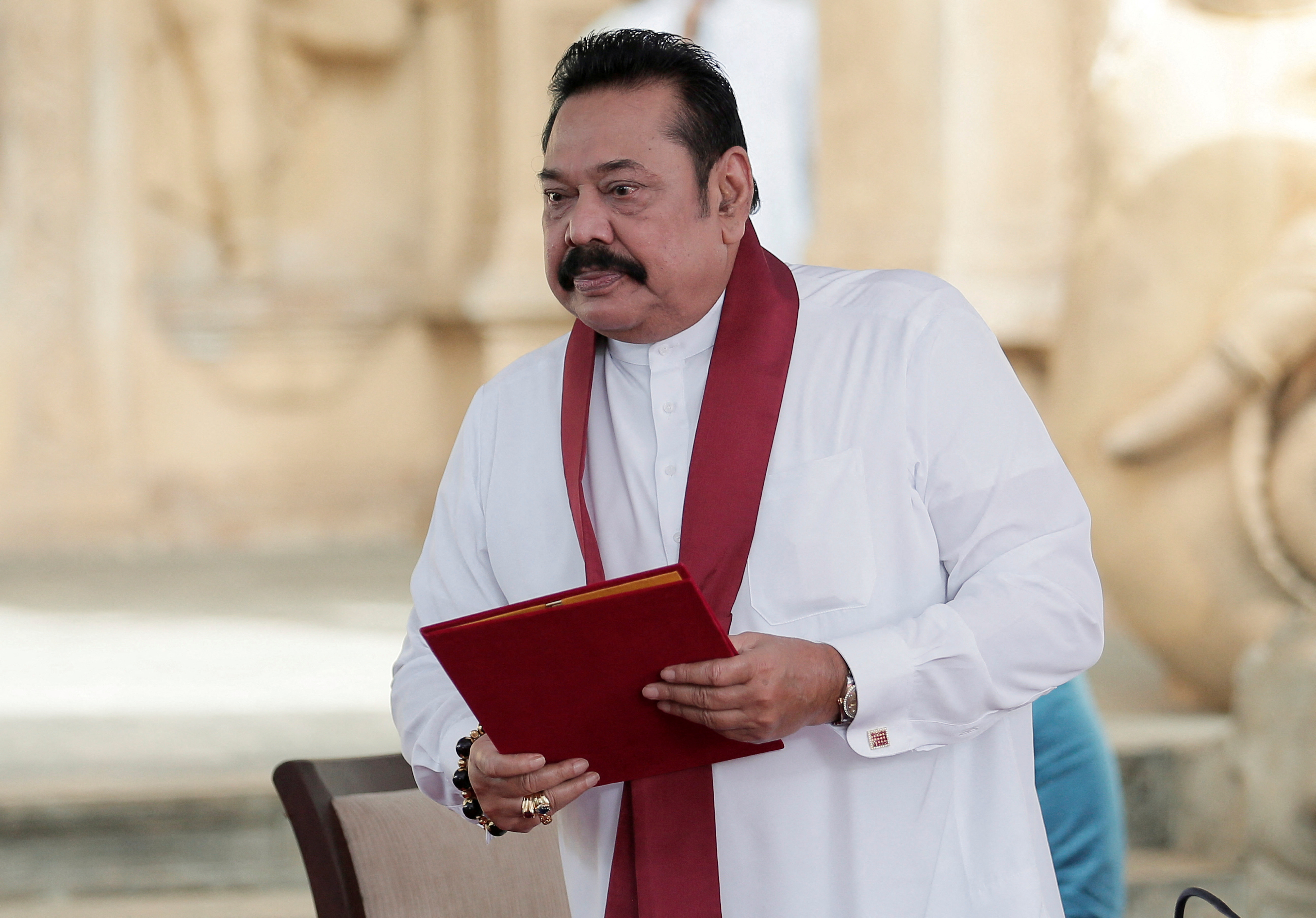 Sri Lanka's former leader Rajapaksa is seen after reading his oaths as the new Prime Minister in front of his brother and Sri Lanka's President Rajapaksa during the swearing in ceremony at Kelaniya Buddhist temple in Colombo
