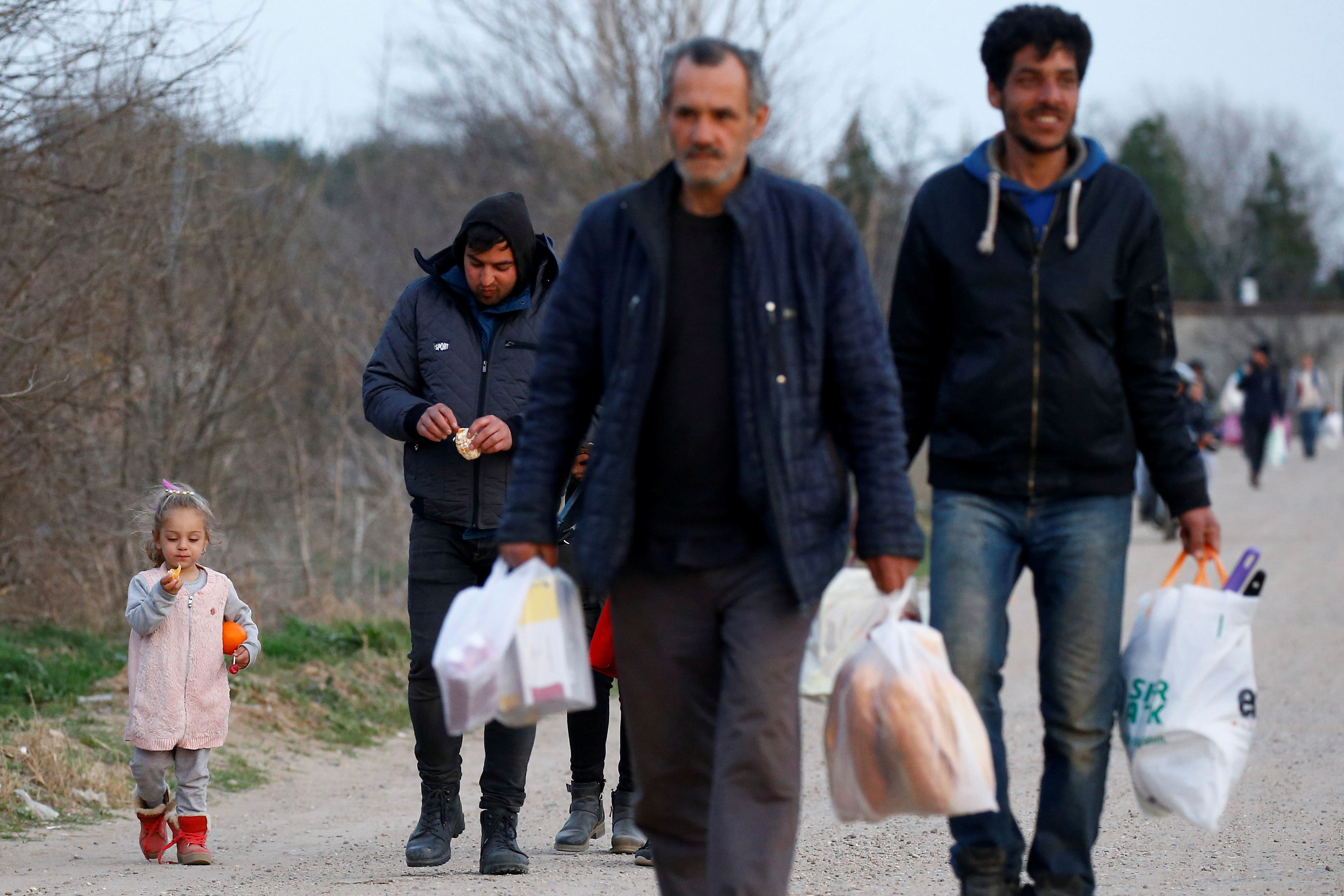 WFILE PHOTO: Migrants walk towards Turkey's Pazarkule in Edirne