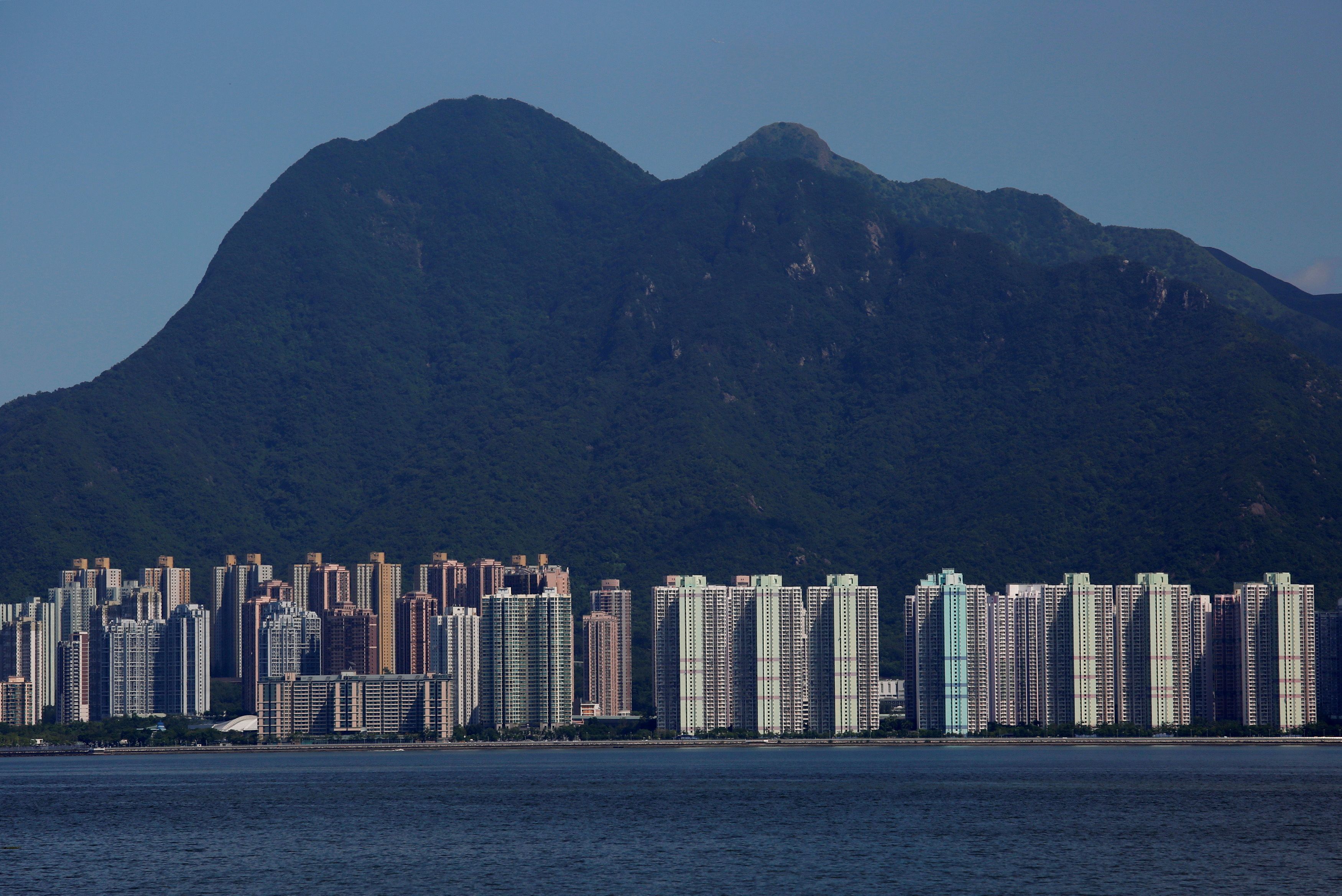 Residential apartments are seen under Ma On Shan peak in Hong Kong