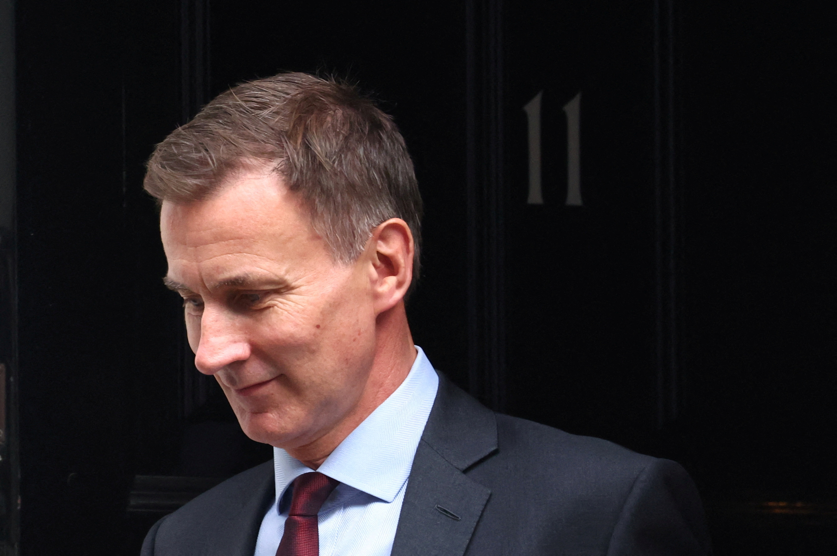 British Chancellor of the Exchequer Jeremy Hunt leaves Downing Street in London