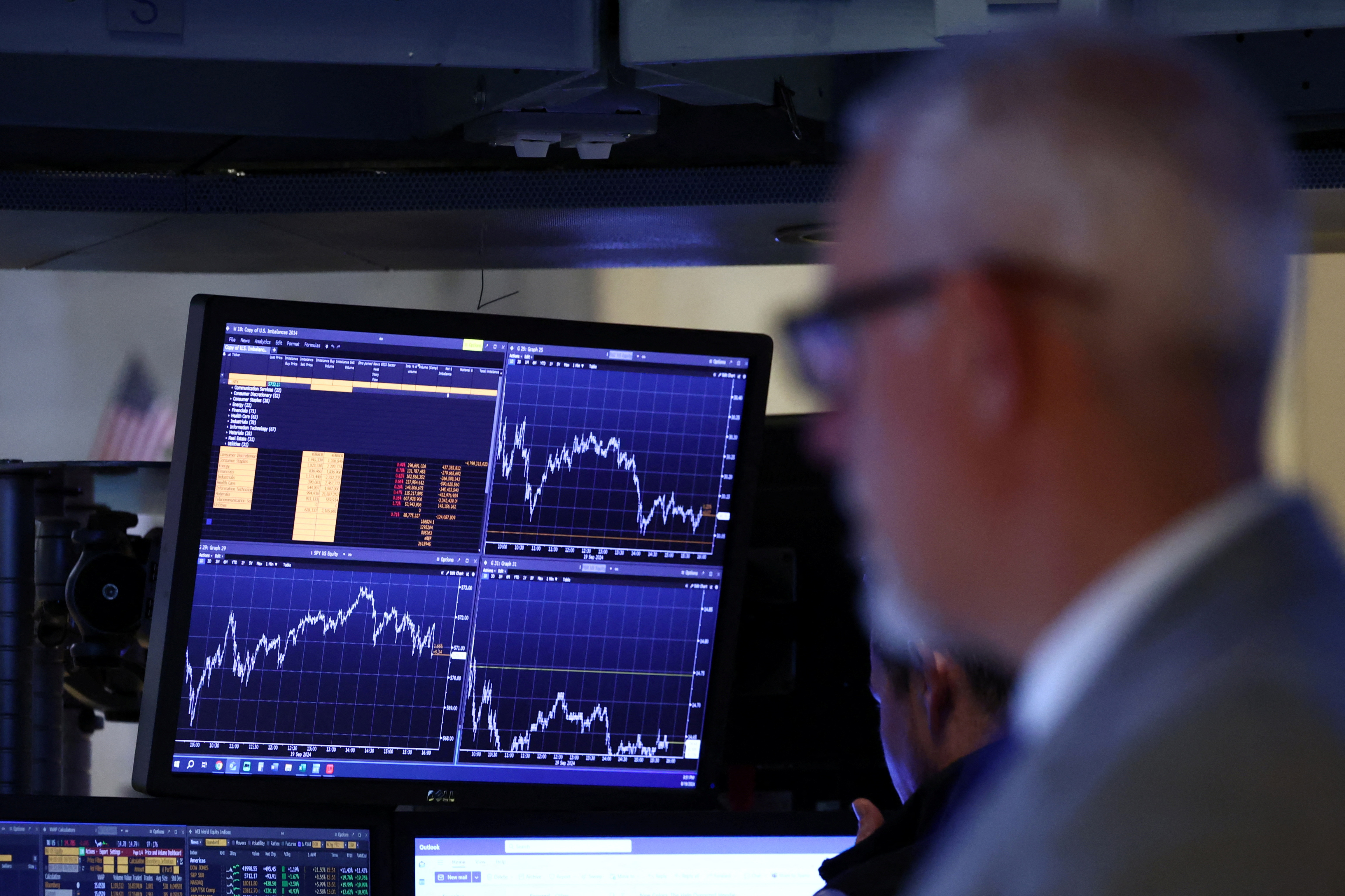 Traders work on the floor of the NYSE in New York