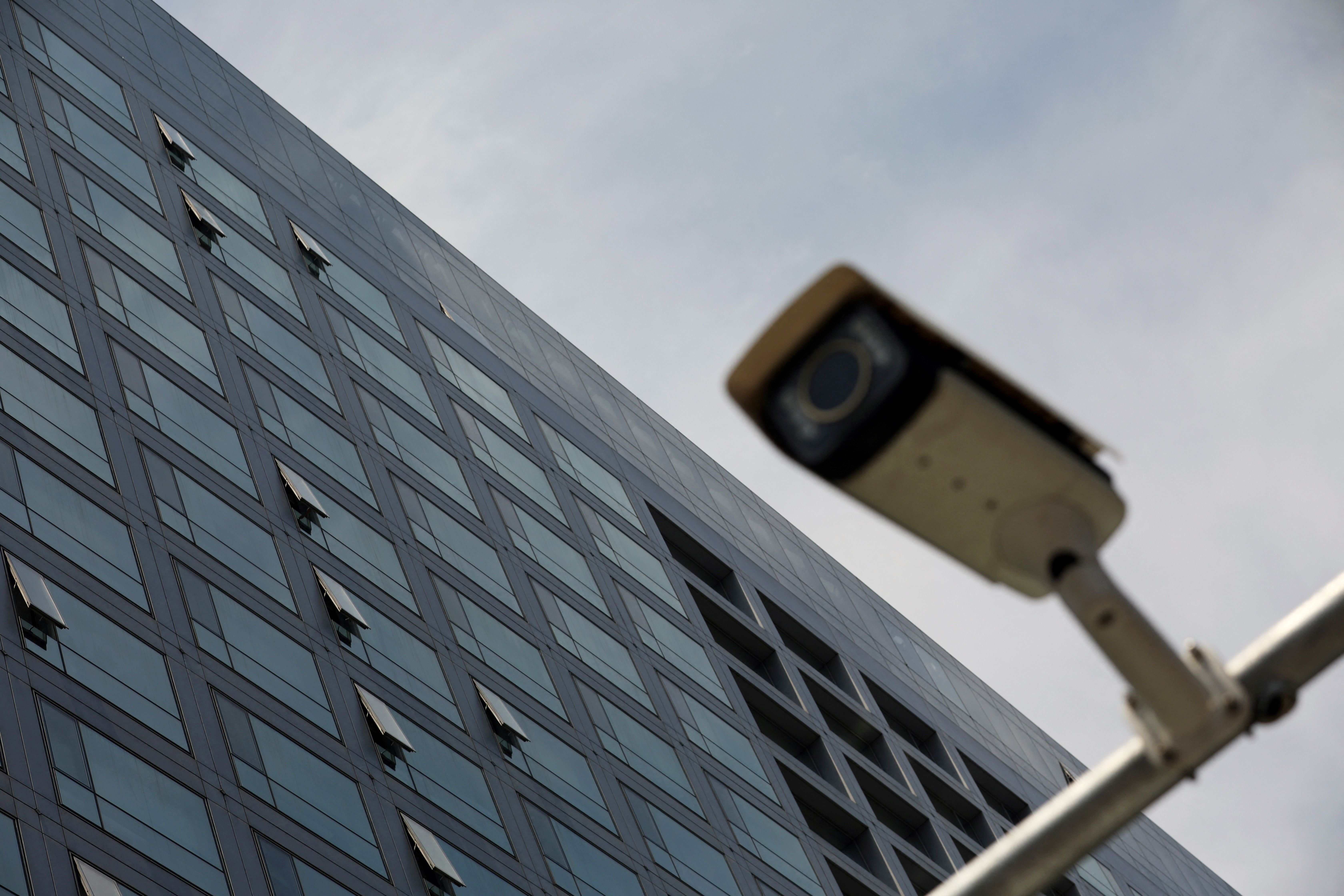 A surveillance camera is pictured outside the China Securities Regulatory Commission (CSRC) building on the Financial Street in Beijing, China July 9, 2021. REUTERS/Tingshu Wang