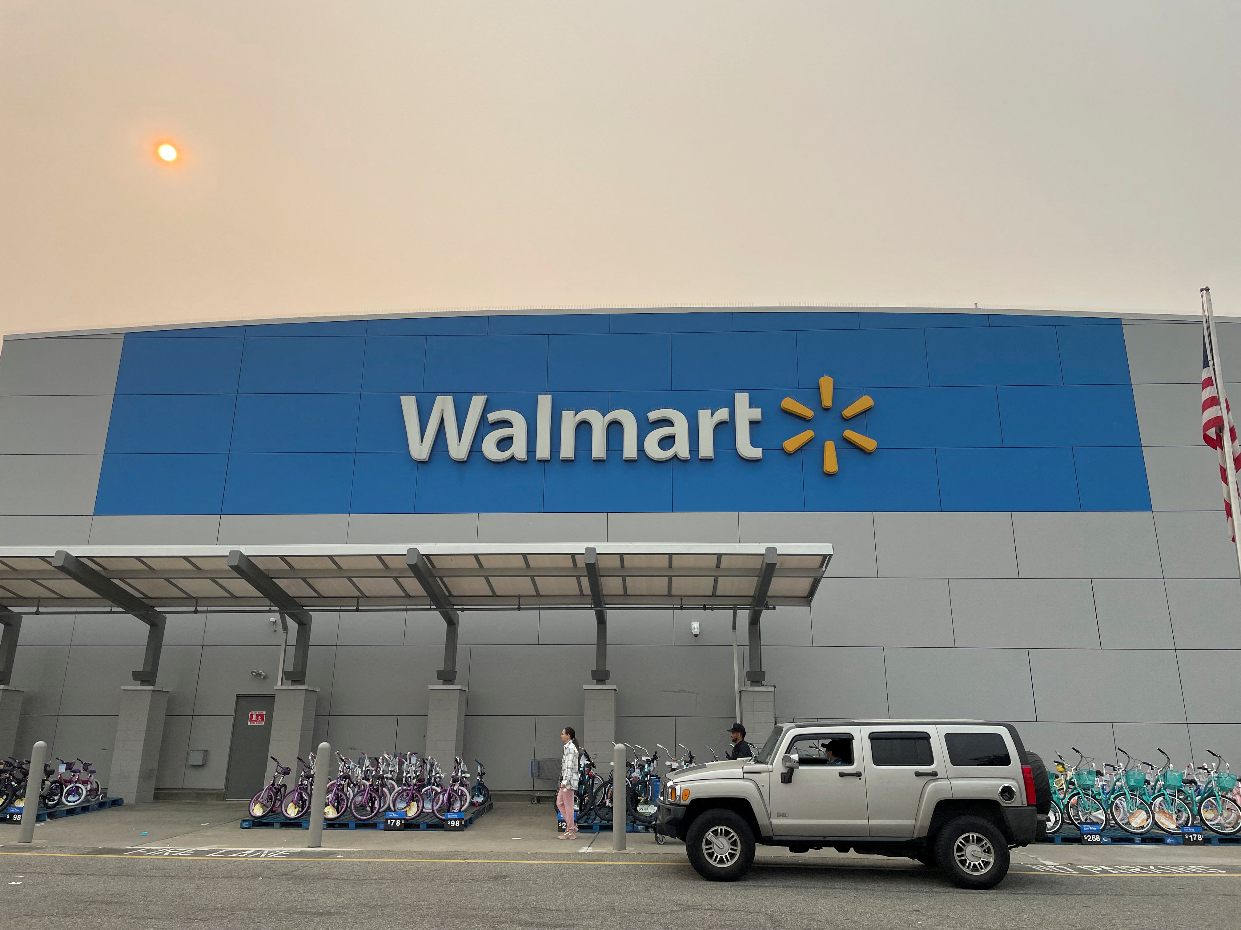 A shopper leaves a Walmart Supercenter in Secaucus, New Jersey