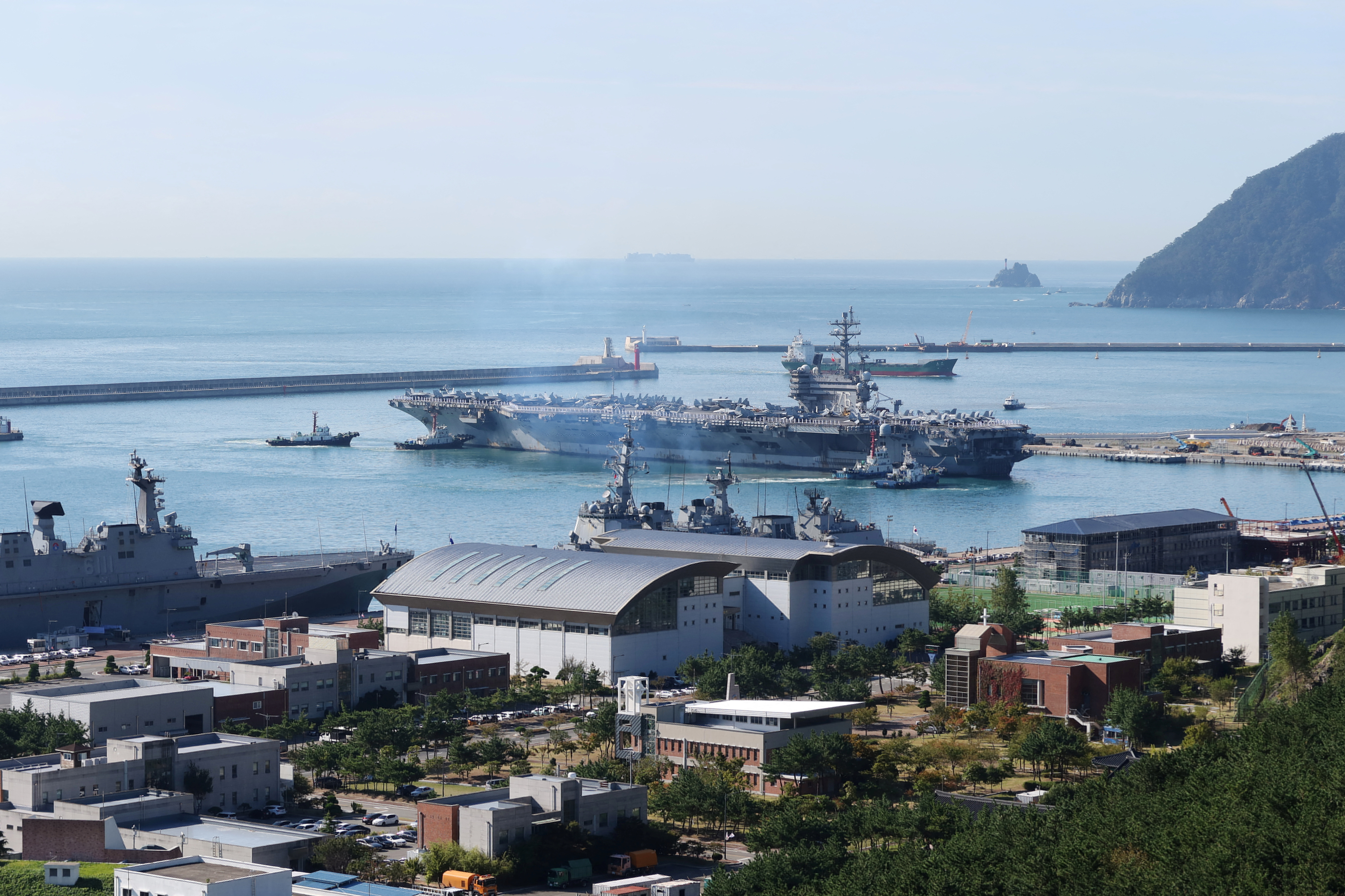 U.S. Navy aircraft carrier USS Ronald Reagan approaches a port in Busan