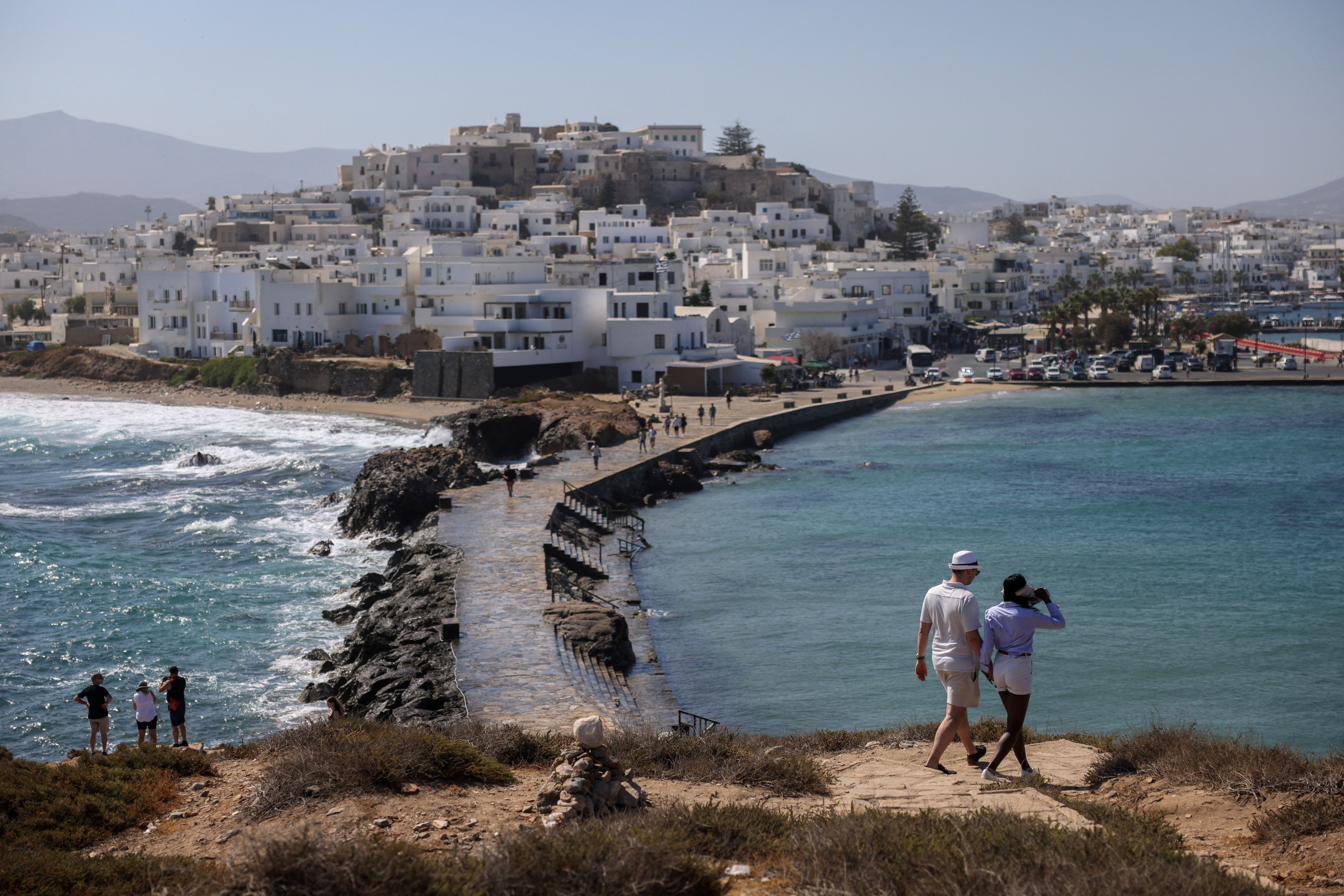 Tourists visit the Chora of the island of Naxos