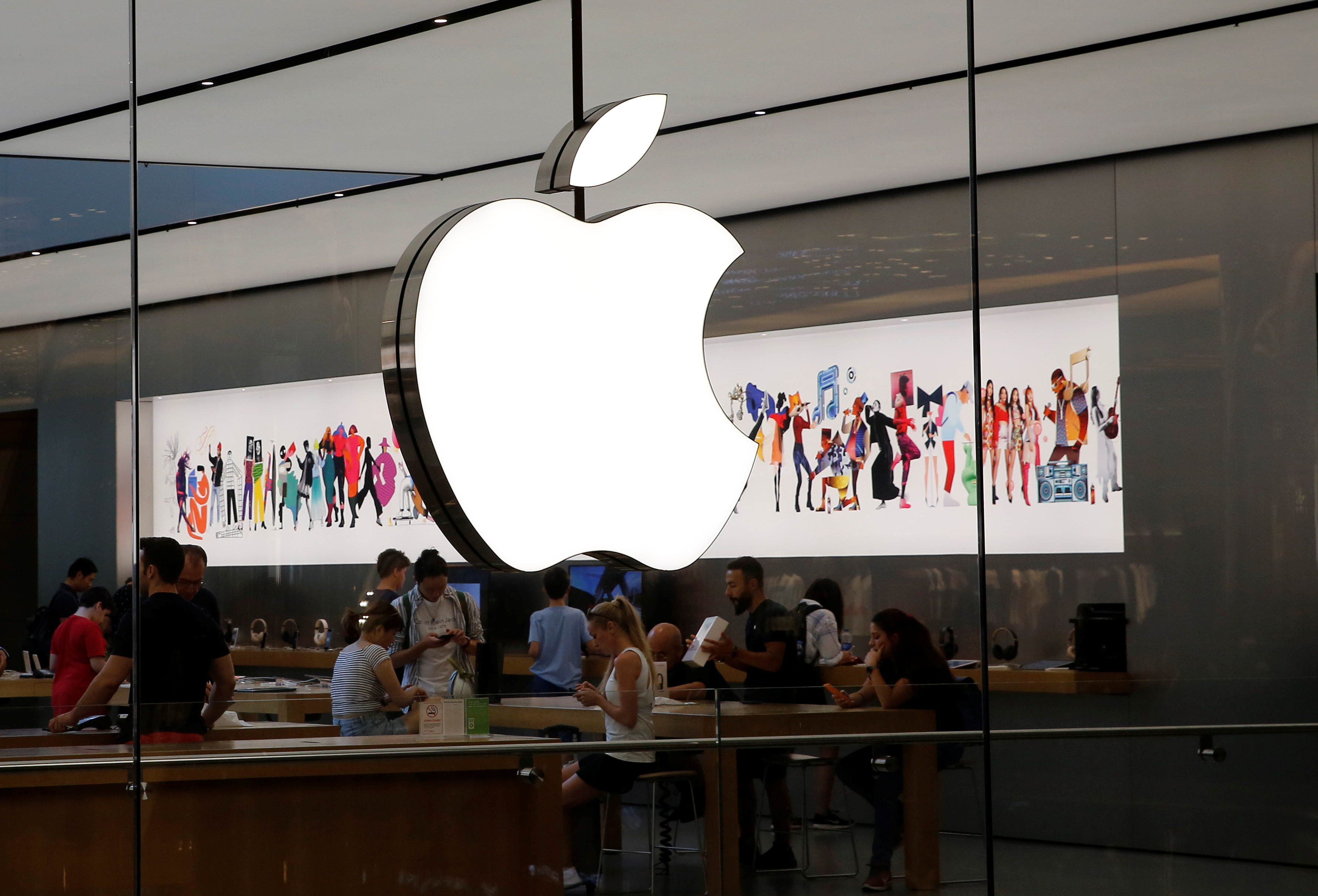 People visit an Apple store in Istanbul