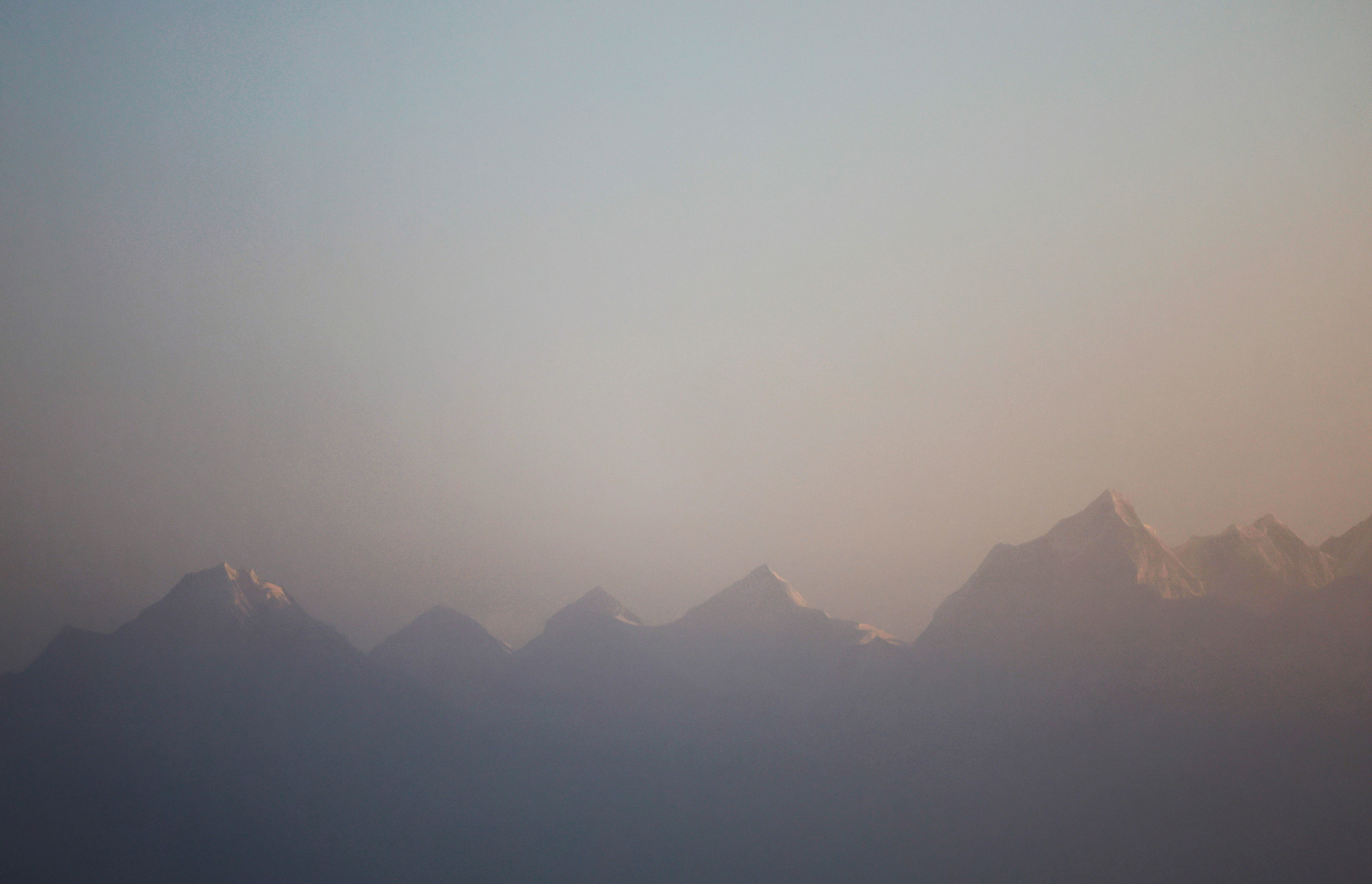 Mount Everest, the world highest peak, and other peaks of the Himalayan range are seen during the sunrise from Ratnange hill in Solukhumbu