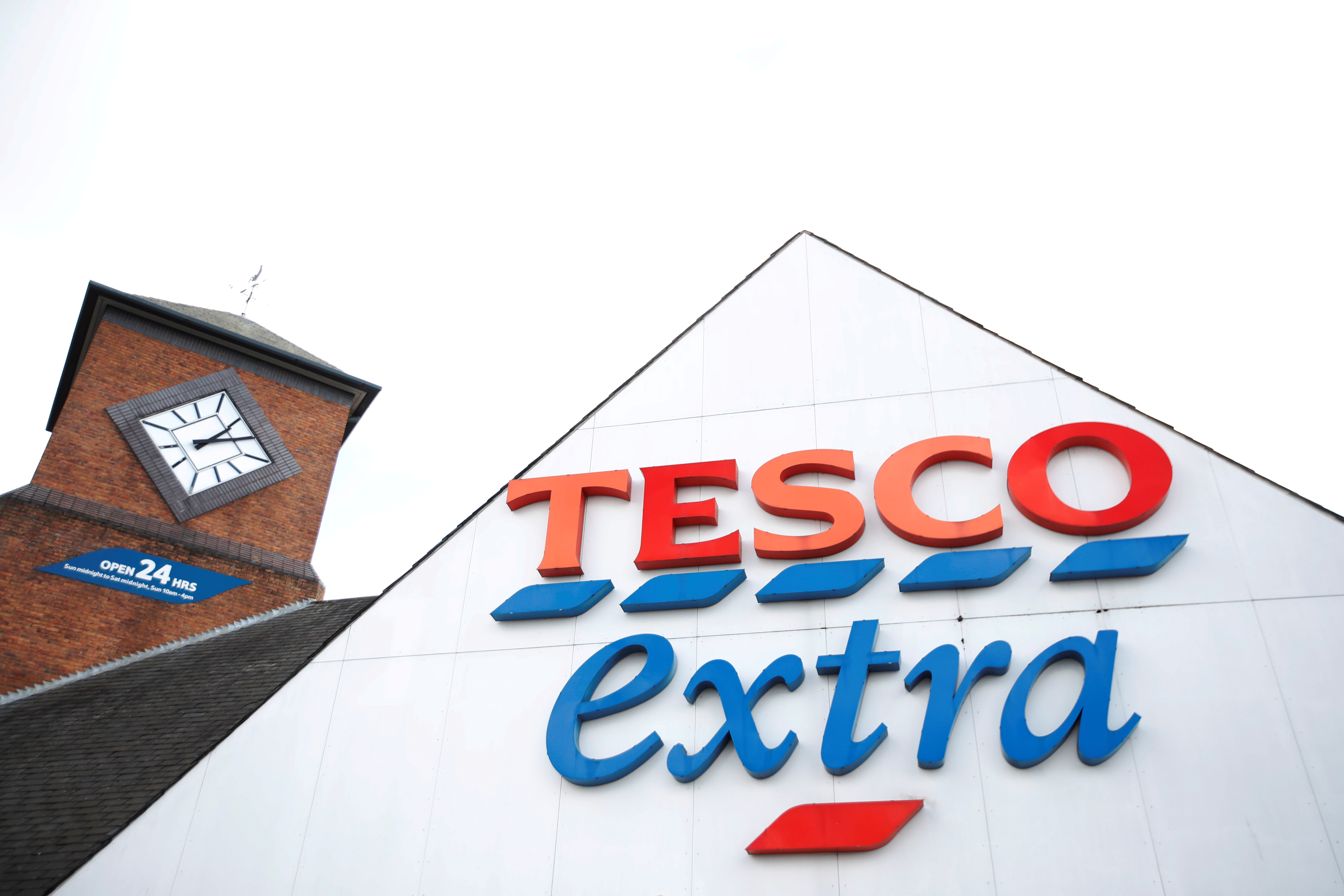 A logo of Tesco is pictured outside a Tesco supermarket in Hatfield